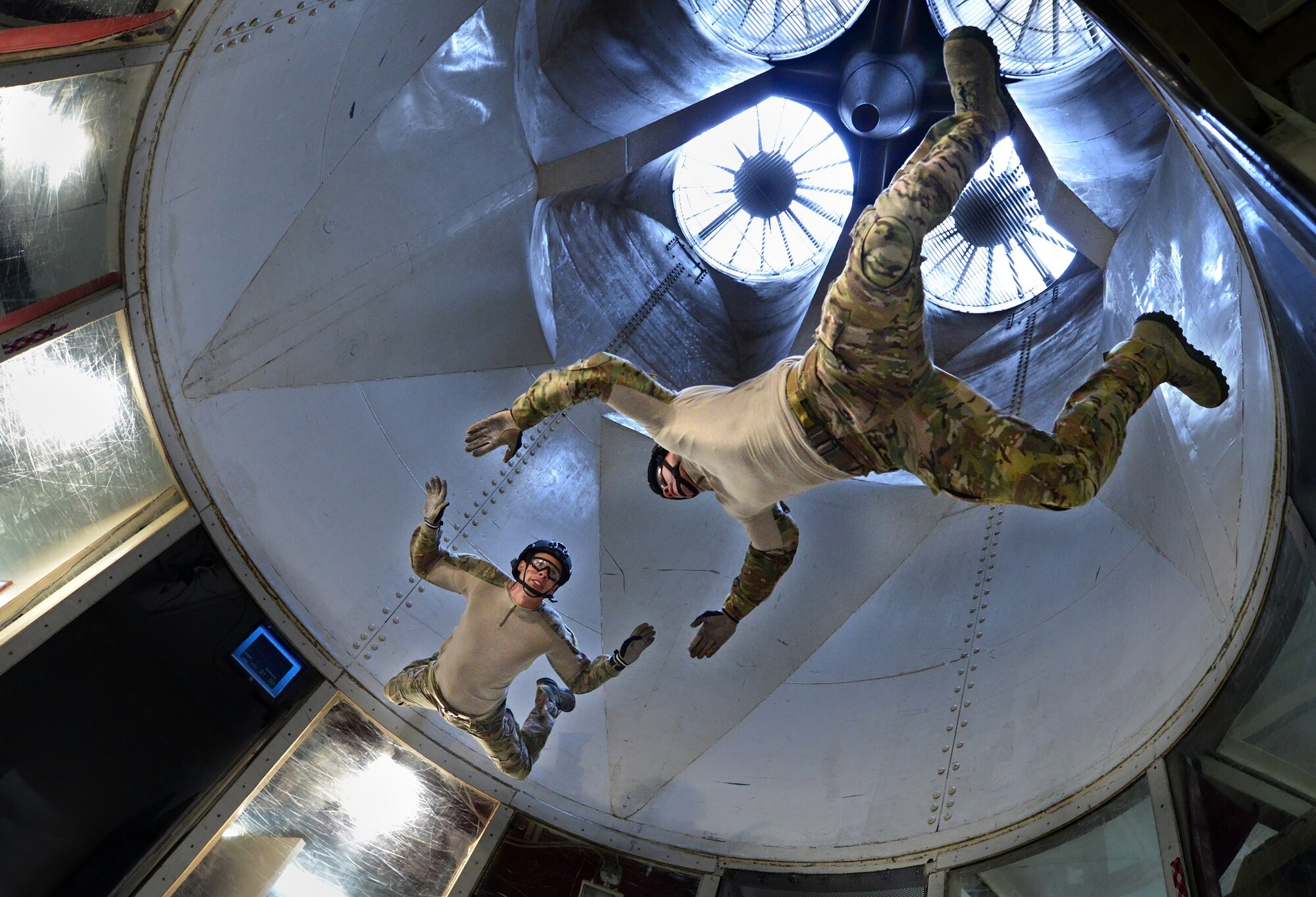 ELOY, Arizona - Two pararescuemen assigned to the 306th Rescue Squadron, Davis-Monthan Air Force Base, Tucson, Arizona, train in the SkyVenture Arizona skydiving wind tunnel in Eloy, Arizona, March 2, 2014. The Special Forces members use the tunnel to practice techniques. Pararescuemen are combat ready rescue and recovery specialists. (U.S. Air Force photo/Tech. Sgt. Frank Oliver)