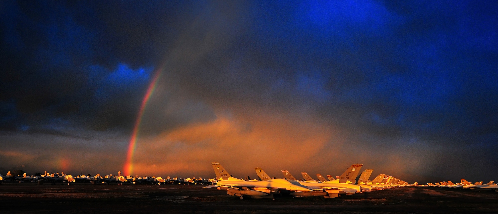 DAVIS-MONTHAN AIR FORCE BASE, Arizona - Storm clouds pass and give way to a rainbow at Davis-Monthan Air Force Base, Tucson, Arizona, March 1, 2014. The beautiful light was cast over the 309th Aerospace Maintenance and Regeneration Group, also known as the Boneyard. (U.S. Air Force photo/Tech. Sgt. Frank Oliver)