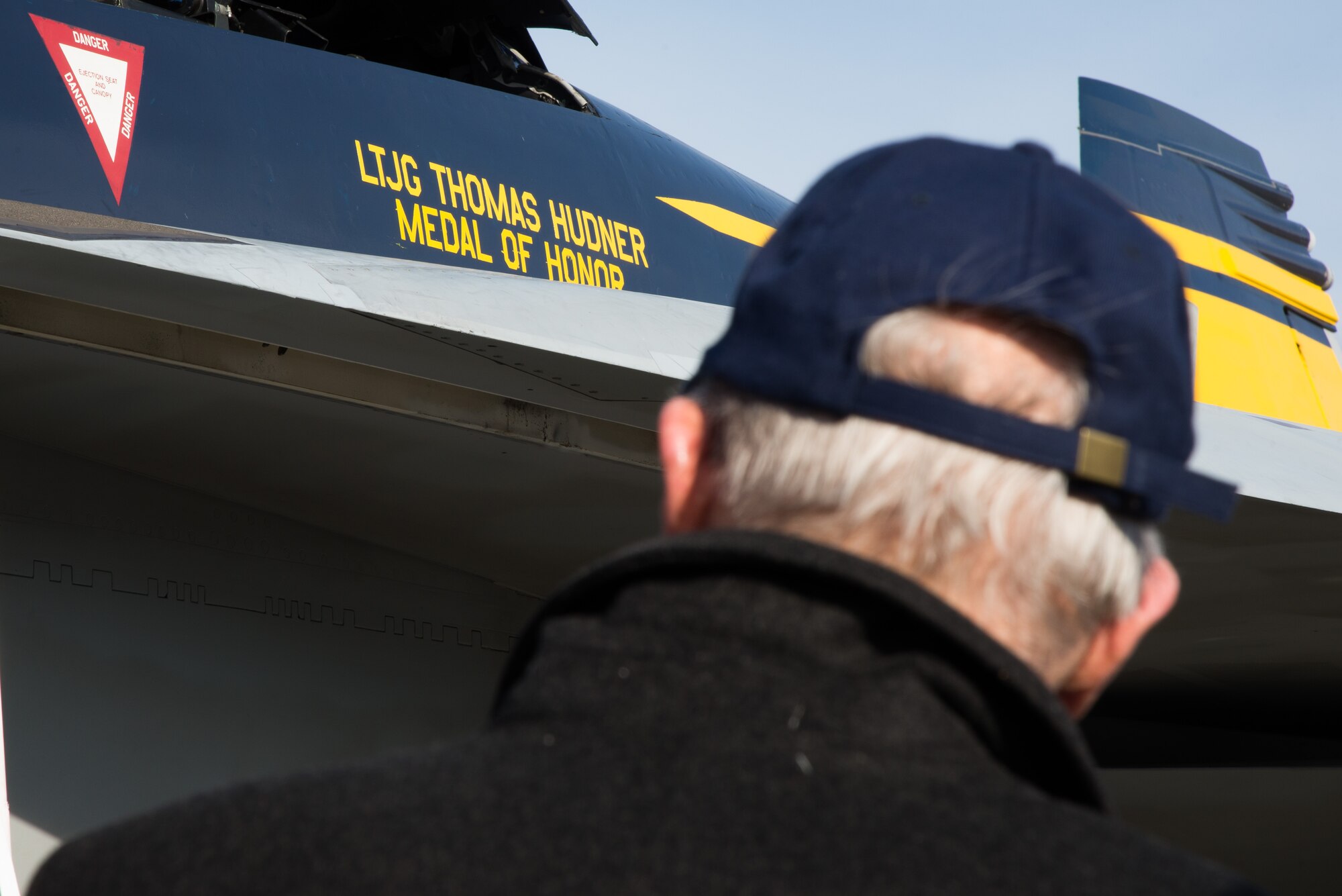 Medal of Honor recipient retired U.S. Navy Capt. Thomas Hudner Jr. looks over an F-18F Super Hornet from Strike Fighter Squadron 32 out of Naval Air Station Oceana, Va., on Dec. 4, 2014. The aircraft bears his name on one side and the name of Ensign Jesse Brown, the pilot Hudner tried to rescue on the other. SFS 32 is the descendant of the unit Hudner flew with during the Korean War. Hanscom hosted the event on the 64th anniversary of the Korean War actions that earned Hudner his Medal of Honor. (U.S. Air Force photo/Mark Herlihy) 