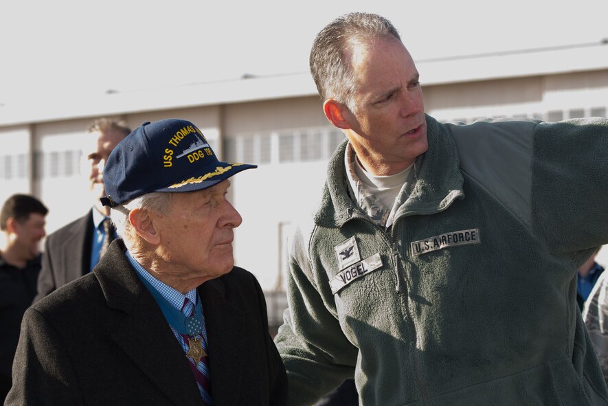 Medal of Honor recipient retired U.S. Navy Capt. Thomas Hudner Jr. and Col. Michael A. Vogel, 66th Air Base Group commander, look at four Navy F-18F Super Hornets from Strike Fighter Squadron 32 out of Naval Air Station Oceana, Va. One of the aircraft bears the name of Medal of Honor recipient Hudner on one side and Ensign Jesse Brown, the pilot Hudner tried to rescue, on the other. SFS 32 is the descendant of the unit Hudner flew with during the Korean War. Hanscom hosted the Dec. 4, 2014, event on the 64th anniversary of the Korean War actions that earned Hudner his Medal of Honor. (U.S. Air Force photo/Mark Herlihy) 
