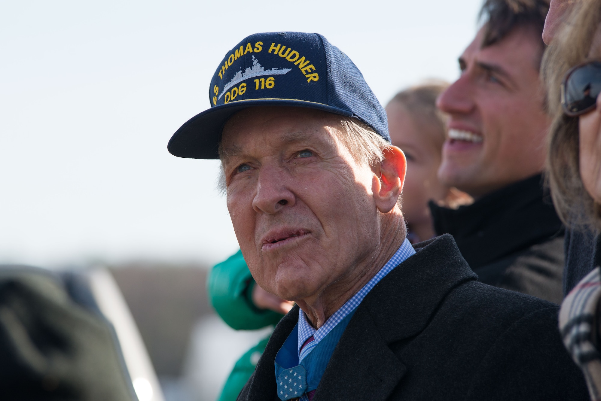 Medal of Honor recipient retired U.S. Navy Capt. Thomas Hudner Jr. and his family look on as four Navy F-18F Super Hornets from Strike Fighter Squadron 32 out of Naval Air Station Oceana, Va., one of which bears the name of Hudner on one side and Ensign Jesse Brown, the pilot Hudner tried to rescue, on the other, prepare to land at Hanscom Air Force Base, Mass., Dec. 4, 2014. SFS 32 is the descendant of the unit Hudner flew with during the Korean War. Hanscom hosted the event on the 64th anniversary of the Korean War actions that earned Hudner his Medal of Honor. (U.S. Air Force photo by Mark Herlihy) 
