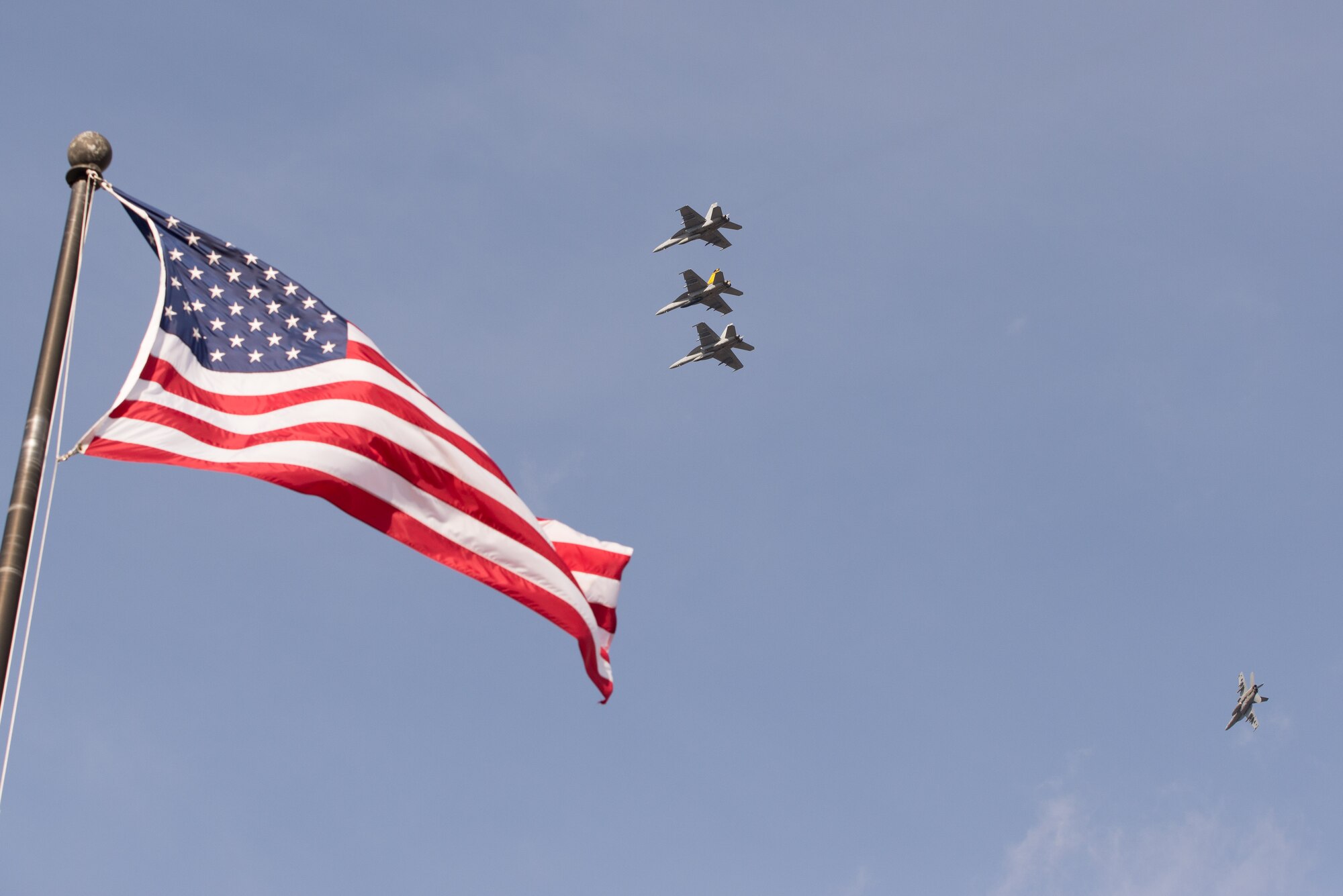 Four Navy F-18F Super Hornets from the Strike Fighter Squadron 32 based at Naval Air Station Oceana, Va., prepare to land at Hanscom Air Force Base, Mass., Dec. 4, 2014. One of the squadron's F-18Fs bears the name of local Medal of Honor recipient retired U.S. Navy Capt. Thomas Hudner Jr. on one side and Ensign Jesse Brown, the pilot Hudner tried to rescue, on the other. SFS 32 is the descendant of the unit Hudner flew with during the Korean War. Hanscom hosted the event on the 64th anniversary of the actions during the Korean War that earned Hudner his Medal of Honor. (U.S. Air Force photo/Mark Herlihy) 