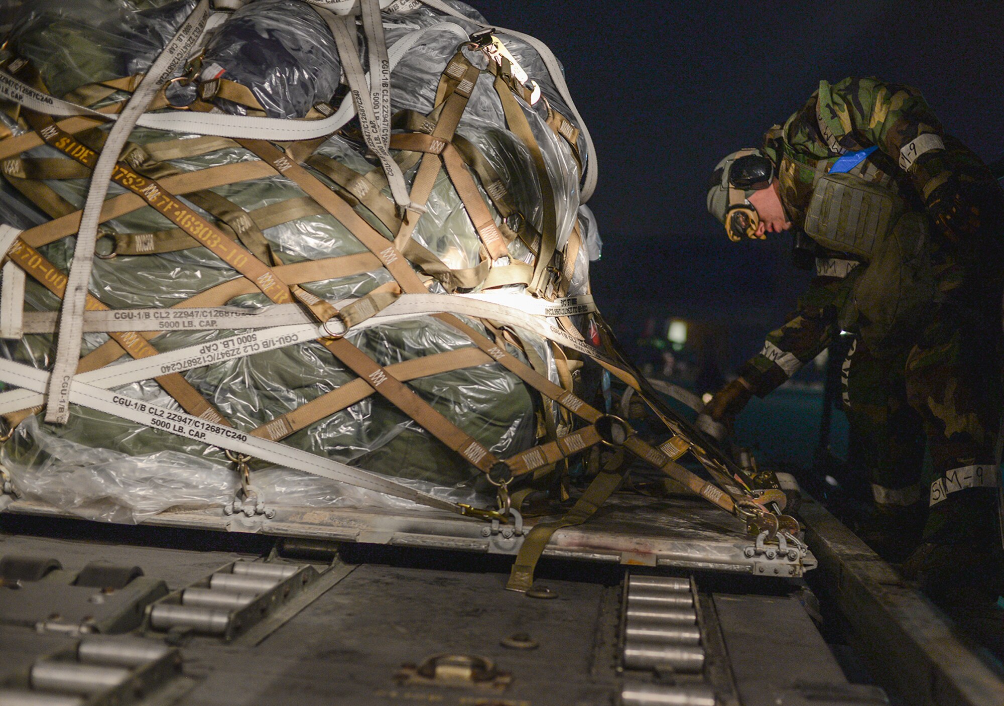 Cargo is unloaded off a C-130 during operational readiness exercise Beverly Bulldog 15-1, Dec. 4, 2014, at Osan Air Base, Republic of Korea. Beverly Bulldog 15-1 is a peninsula-wide ORE designed to test American forces mission readiness in the event of an emergency or wartime environment. (U.S. Air Force photo by Staff Sgt. Jake Barreiro)










