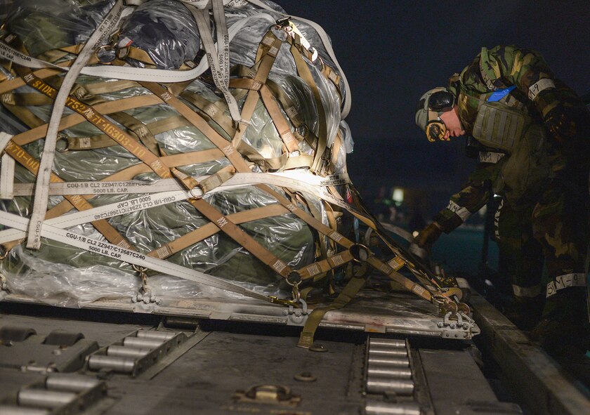 Cargo is unloaded off a C-130 during operational readiness exercise Beverly Bulldog 15-1, Dec. 4, 2014, at Osan Air Base, Republic of Korea. Beverly Bulldog 15-1 is a peninsula-wide ORE designed to test American forces mission readiness in the event of an emergency or wartime environment. (U.S. Air Force photo by Staff Sgt. Jake Barreiro)










