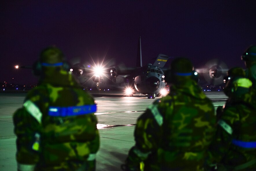 Airmen from the 731st Air Mobility Squadron receive a C-130 carrying cargo and personnel during operational readiness exercise Beverly Bulldog 15-1, Dec. 4, 2014, at Osan Air Base, Republic of Korea. Beverly Bulldog 15-1 is a peninsula-wide ORE designed to test American forces mission readiness in the event of an emergency or wartime environment. (U.S. Air Force photo by Staff Sgt. Jake Barreiro)








