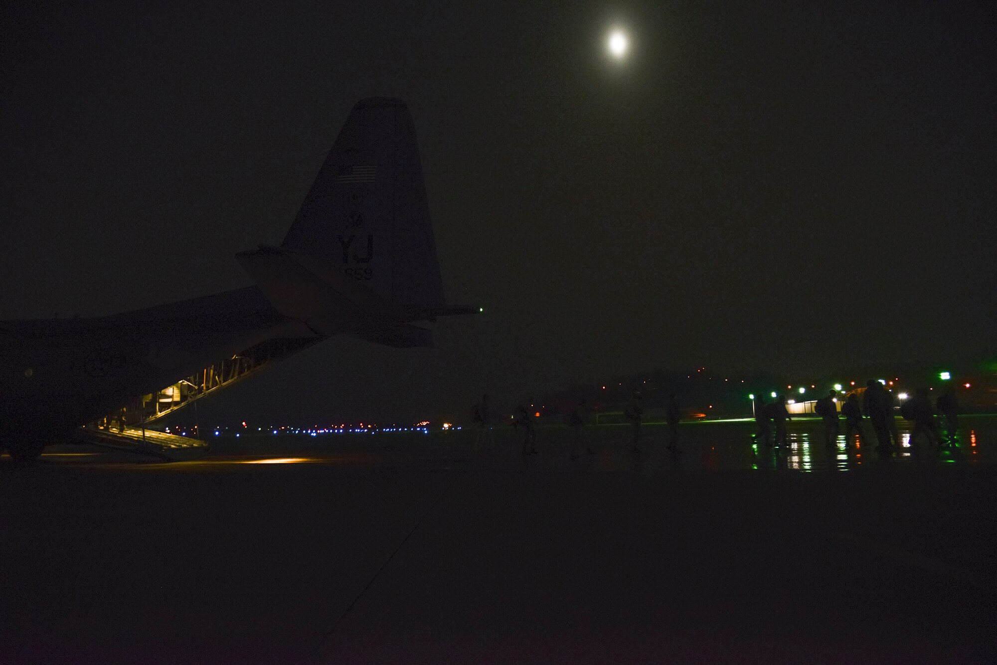 Personnel depart a C-130 while arriving at Osan Air Base, Republic of Korea, during operational readiness exercise Beverly Bulldog 15-1 Dec. 4, 2014. Beverly Bulldog 15-1 is a peninsula-wide ORE designed to test American mission readiness in the event of an emergency or wartime environment. (U.S. Air Force photo by Staff Sgt. Jake Barreiro)


