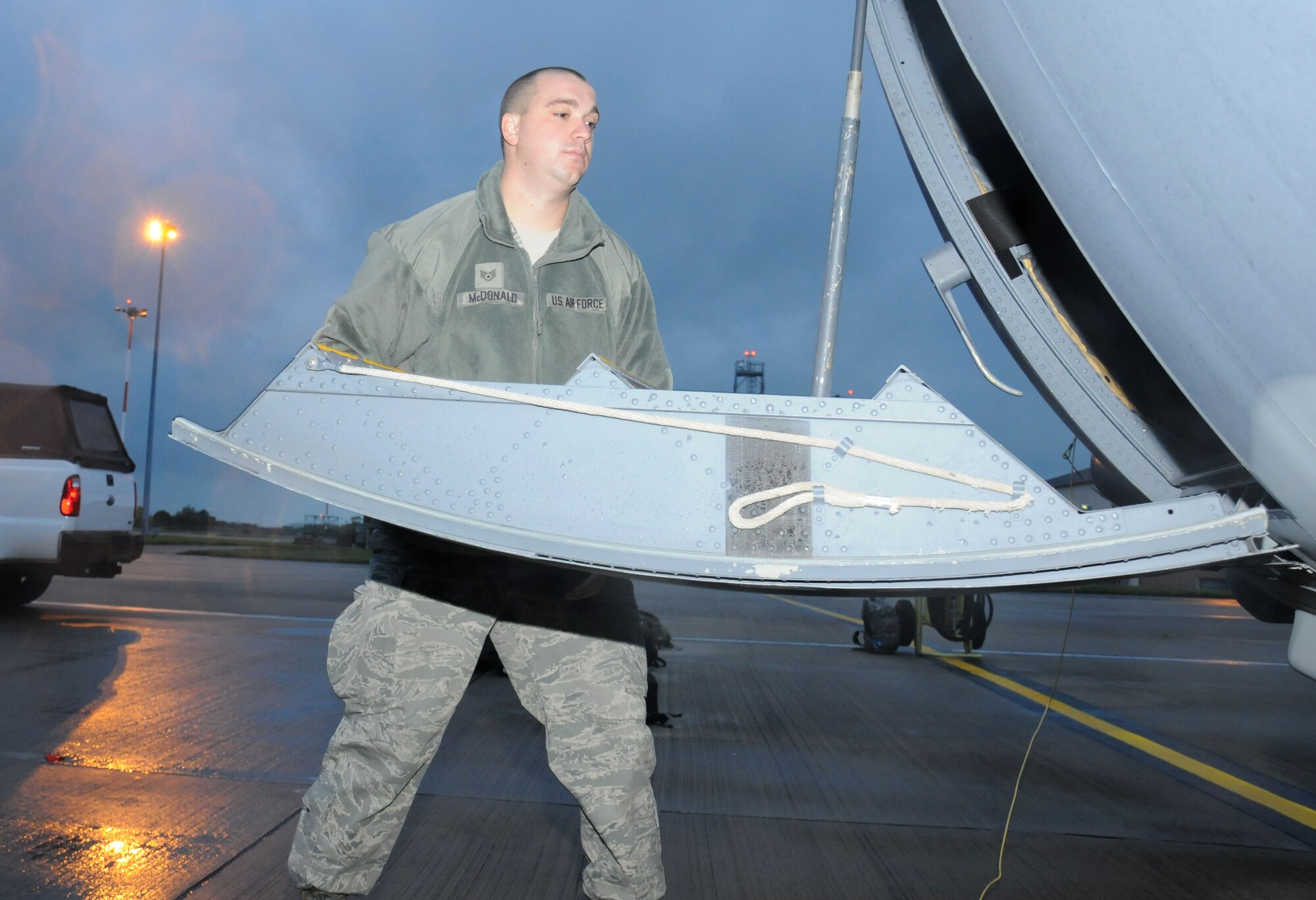 U.S. Air Force Staff Sgt. Randy McDonald, 352nd Special Operations Maintenance Squadron dedicated crew chief from Sumter, S.C., inspects the door of an MC-130J Commando II Oct. 21, 2014, on RAF Mildenhall, England. McDonald and other dedicated crew chiefs are responsible for millions of dollars worth of aircraft equipment and the people that operate them. (U.S. Air Force photo by Gina Randall/Released)