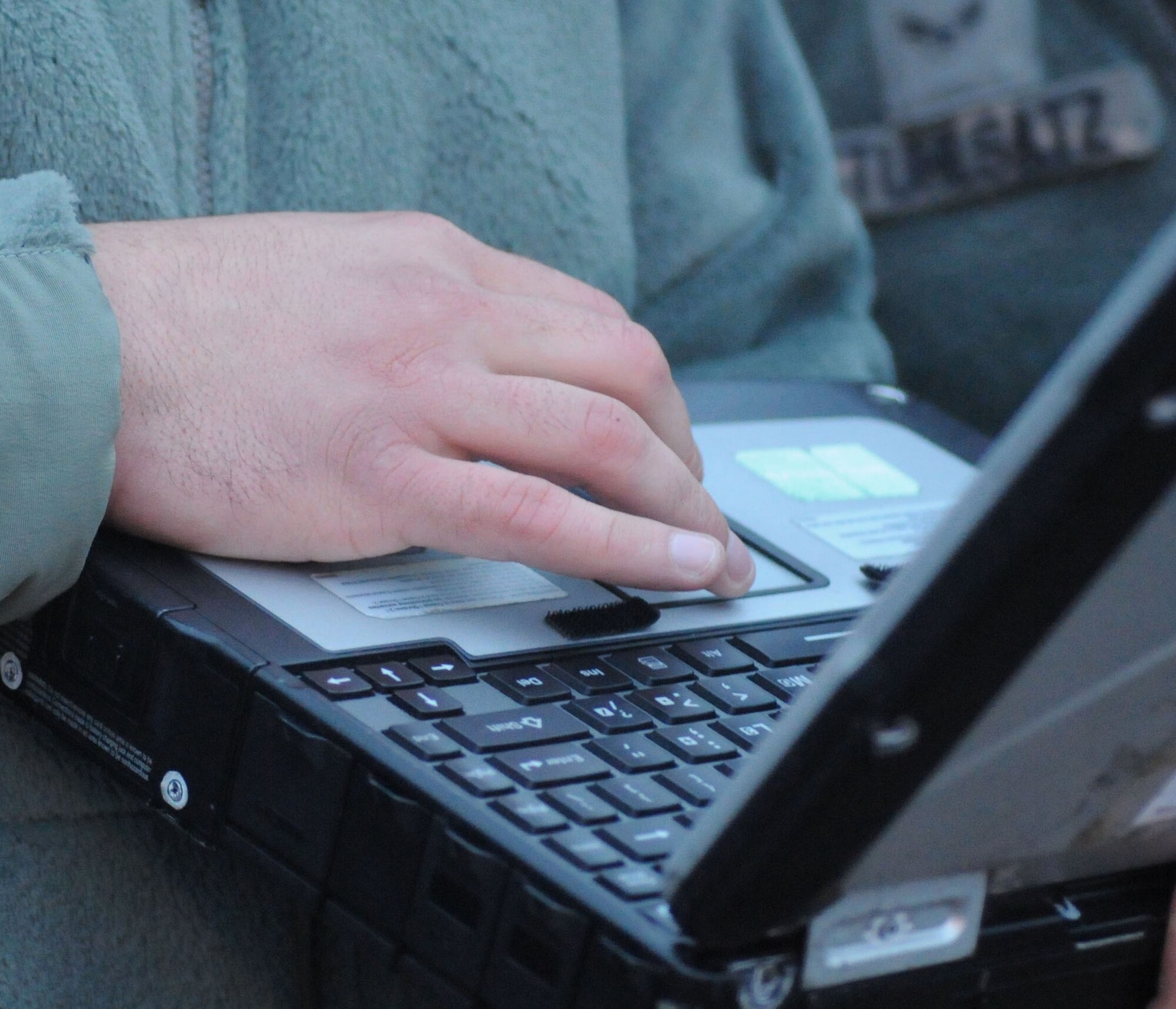 U.S. Air Force Staff Sgt. Randy McDonald, 352nd Special Operations Maintenance Squadron dedicated crew chief from Sumter, S.C., checks a technical order on a laptop Oct. 21, 2014, on RAF Mildenhall, England. Crew chiefs use TOs to accurately perform maintenance tasks. (U.S. Air Force photo by Gina Randall/Released)