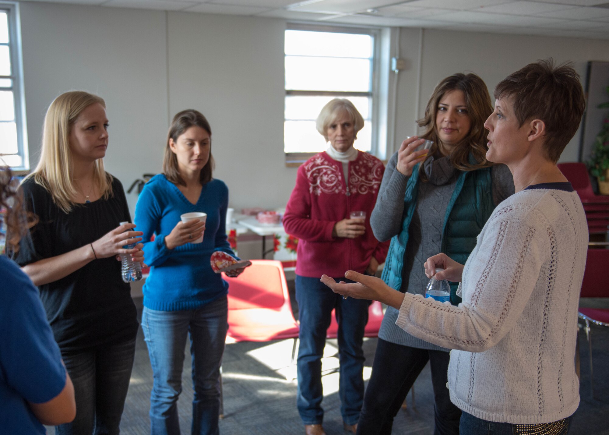 Key Spouse coordinator Tina Harstad, right, talks with (from left) Megan Polos, Marsha Mallizzio, Pam LeBlanc, and Michelle Will Dec. 6 at the 934th Airlift Wing. (U.S. Air Force Photo/Staff Sgt. Trevor Saylor)