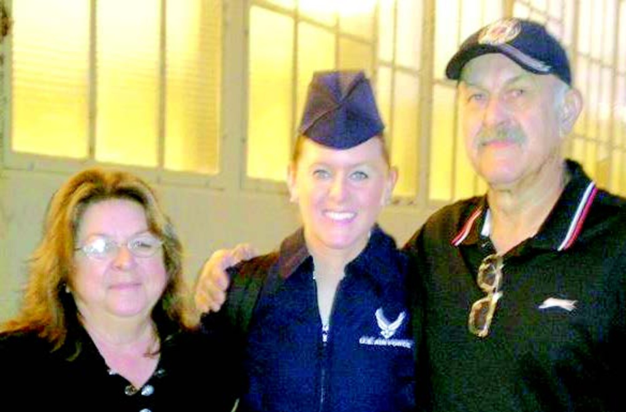 Kristie Volchko flanked by her mom, Carole (L), and her dad, Ronald, following her graduation from training in Wichita Falls, TX.
