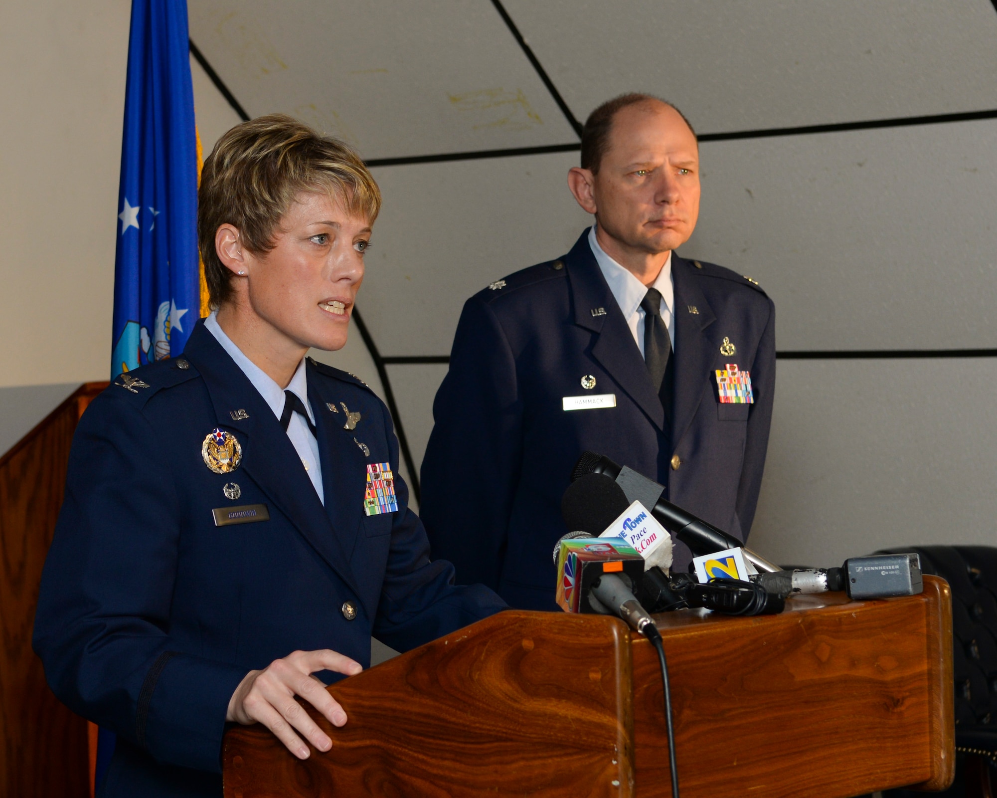 Col. Kristin Goodwin, 2nd Bomb Wing commander and Lt. Col. Michael Hammack, 2nd Aircraft Maintenance Squadron commander, answer questions during a press conference regarding Airman Alec Dye on Barksdale Air Force Base, La., Dec. 6, 2014. Dye, a crew chief from 2nd AMXS, deployed to Andersen Air Force Base, Guam, went missing near Tarague Beach, Guam early on Dec. 1. On Dec. 3, remains were recovered on the beach near where he went missing, and on Dec. 4 those remains were confirmed to be Dye?s.