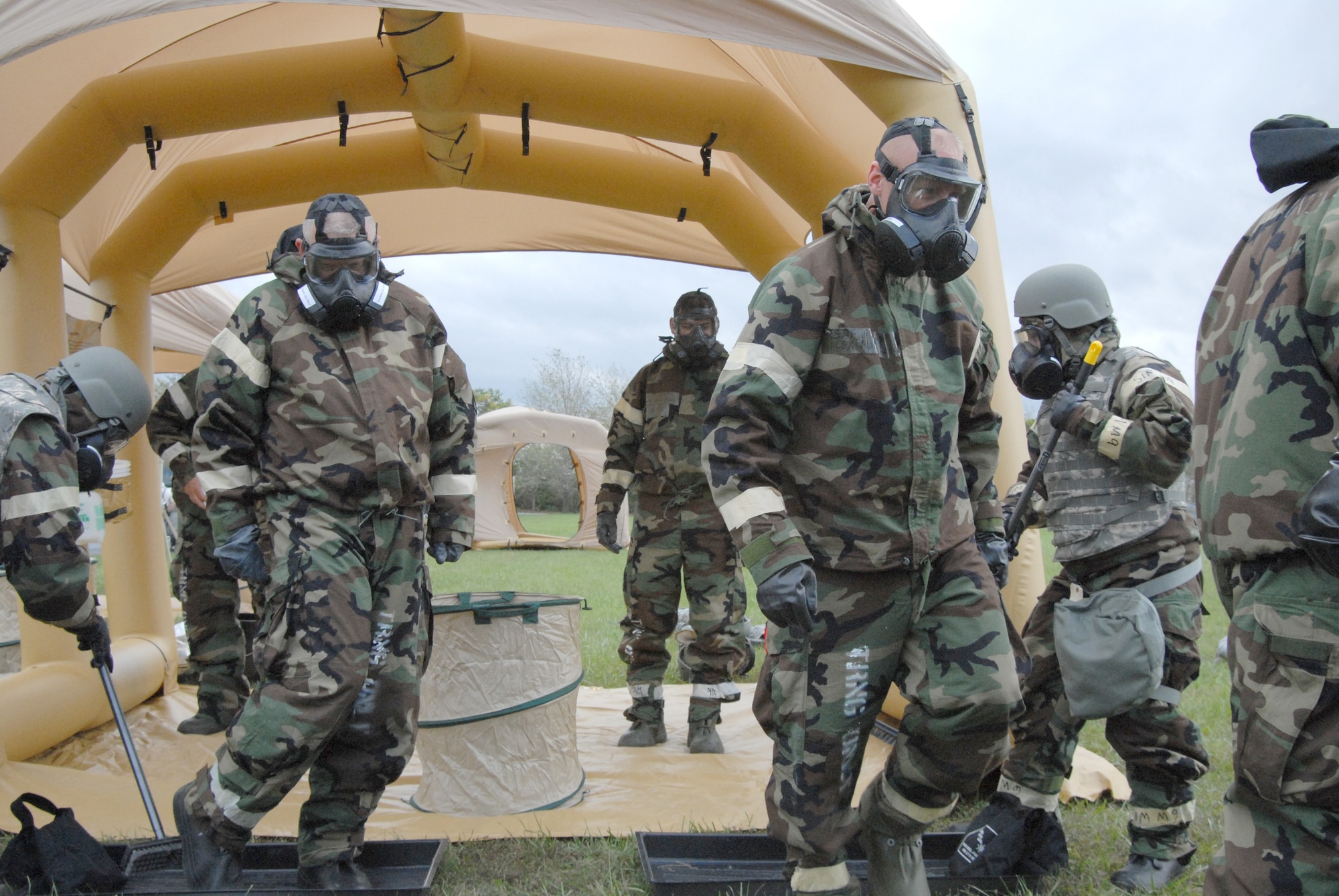 Airmen from the 193rd Special Operations Civil Engineer Squadron simulate decontaminating their gear during an exercise Oct. 4 at the Fort Indiantown Gap Regional Training Site in Annville, Pennsylvania. The annual bivouac exercise helps power production and operations personnel, as well as emergency managers and firefighters learn how to master their skills and accomplish their mission under austere field conditions that may include chemical, biological, radiological, nuclear and environmental threats. (U.S. Air National Guard photo by Staff Sgt. Susan Penning/Released) 