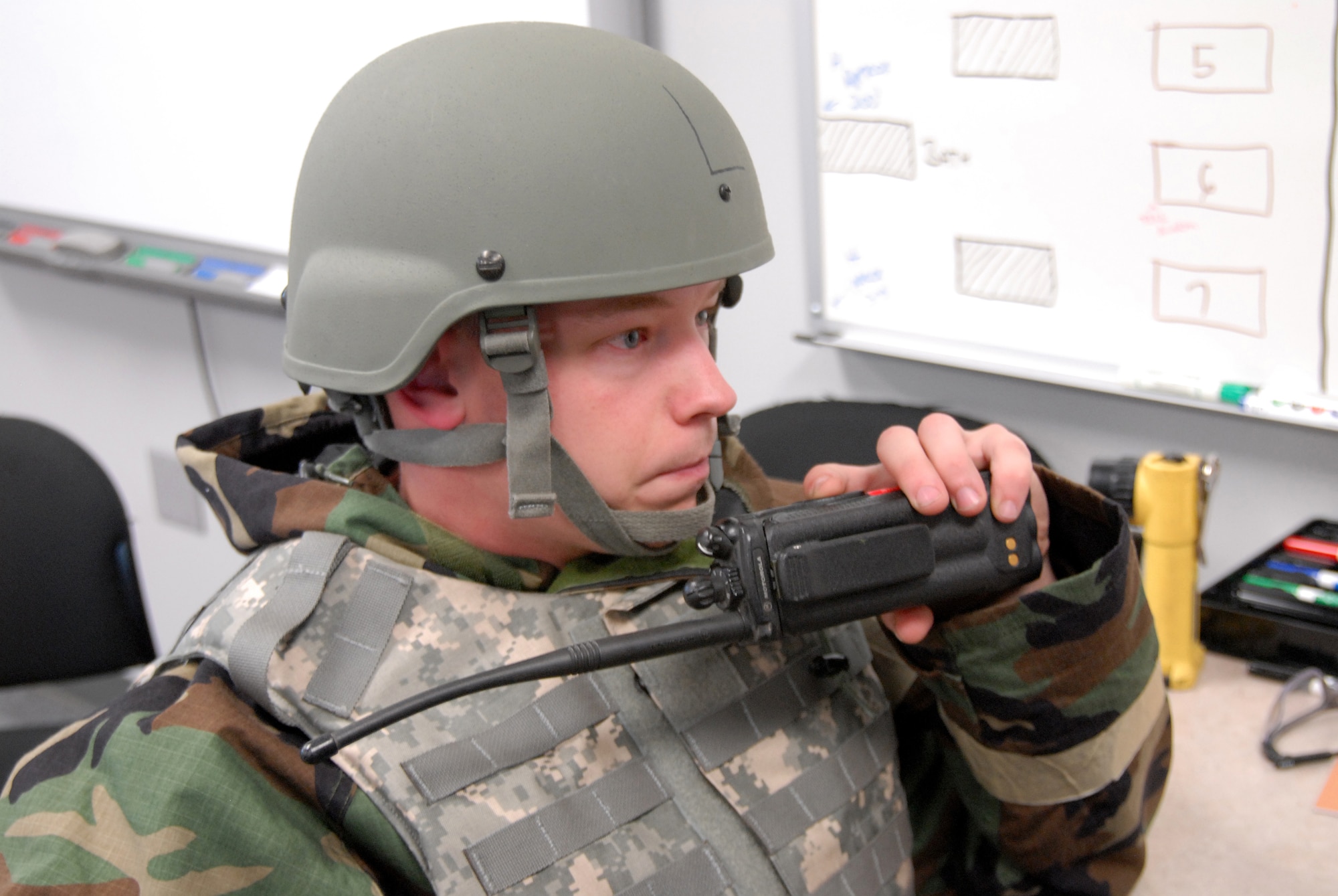 Staff Sgt. Jody Meade, 193rd Special Operations Civil Engineer Squadron firefighter, mans the fire alarm communications system, rerouting information from unit to unit, during an annual bivouac training exercise Oct. 4 at the Fort Indiantown Gap Regional Training Site in Annville, Pennsylvania. The exercise helps power production and operations personnel, as well as emergency managers and firefighters learn how to master their skills and accomplish their mission under austere field conditions that may include chemical, biological, radiological, nuclear and environmental threats. (U.S. Air National Guard photo by Staff Sgt. Susan Penning/Released) 
