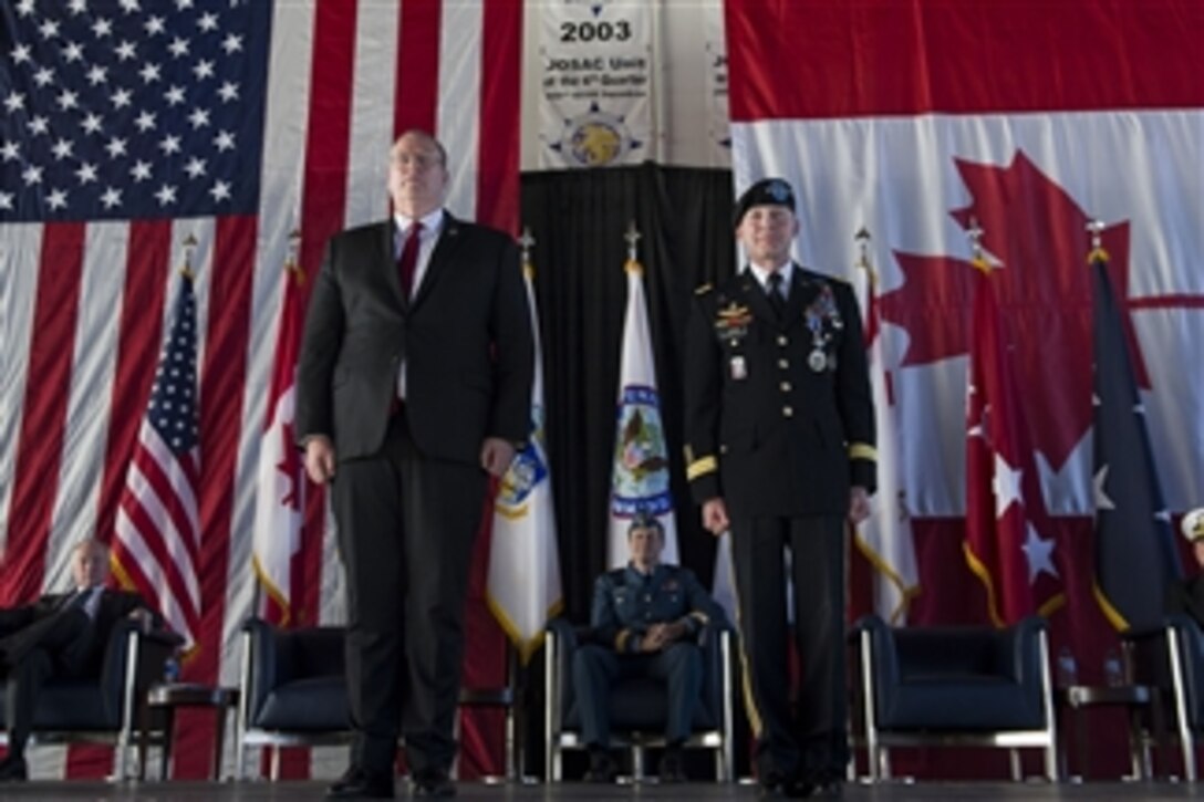 Deputy Defense Secretary Bob Work, left, stands with Army Gen. Charles H. Jacoby Jr. during a change-of-command ceremony for U.S. Northern Command and North American Aerospace Defense Command on Peterson Air Force Base in Colorado Springs, Colo., Dec. 5, 2014. Jacoby relinquished command to Navy Adm. William E. Gortney. 