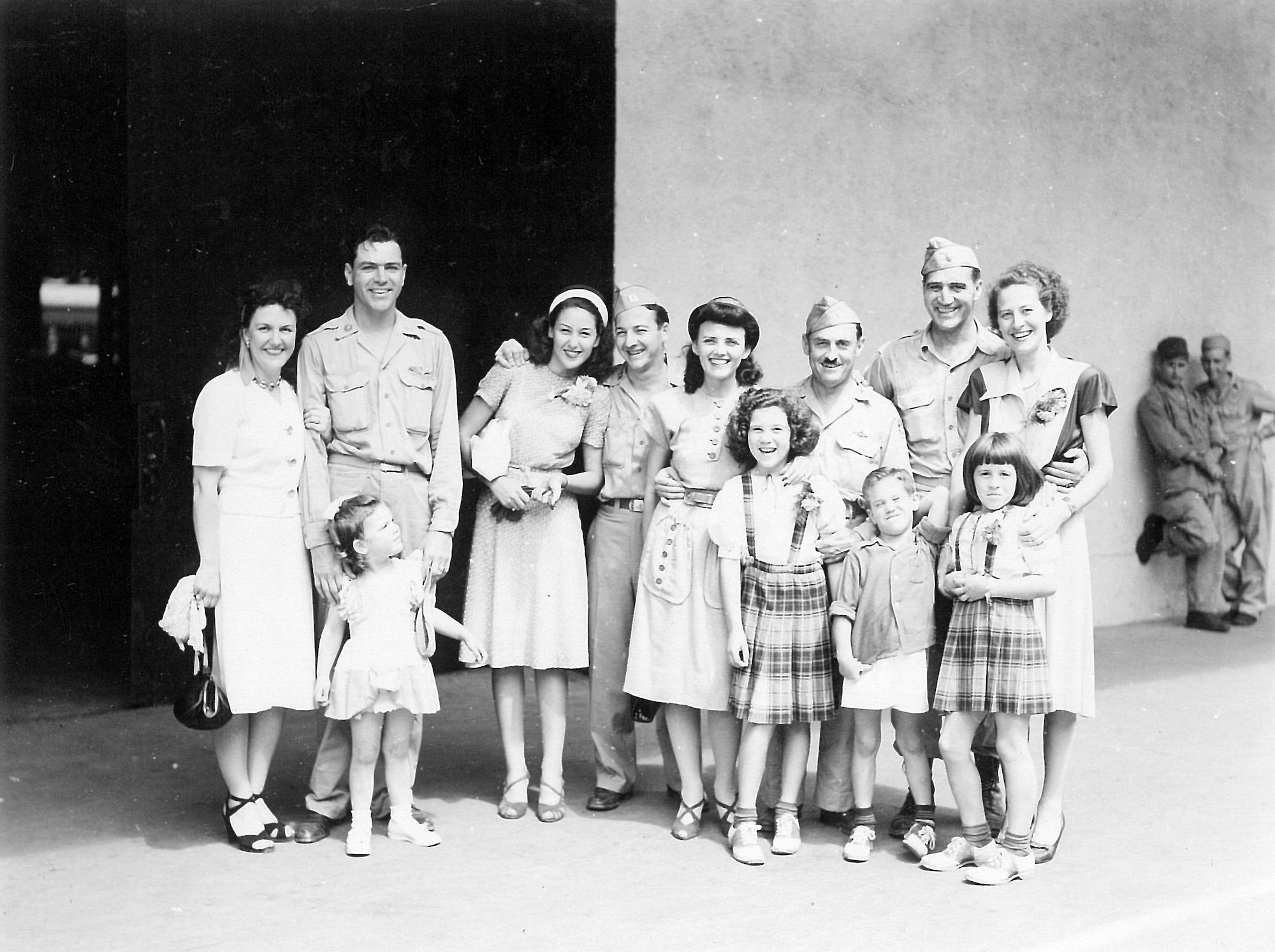 A photo of incoming dependents and Yokota Airmen taken at the Yokohama
dock in August 1946. Base commander Col. Edwin Bobzien is third from the
right, and Mrs. Bobzien is standing next to him. (U.S. Air Force photo courtesy
of the 374 AW History Office)