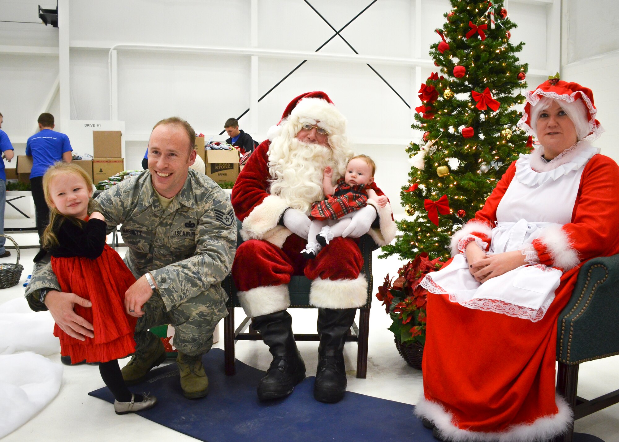 U.S. Airmen with the 128th Air Refueling Wing and their families participated in the wing holiday part here Dec. 6 2014.  Holiday party activities included visiting with Santa, children's crafts, a silent aution, and a wing trivia contest.  (U.S. Air National Guard photo by Master Sgt. Thomas J. Sobczyk/Released)