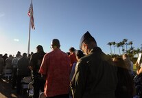 Attendees of the Attack on Hickam Field Remembrance Ceremony bow their heads during an invocation at Joint Base Pearl Harbor-Hickam, Hawaii Dec. 7, 2014. This year’s ceremony marks 73 years to the day since the attack occurred. More than 50 survivors and family members of survivors attended the ceremony, which honors the 189 Airmen who lost their lives in the attack. (U.S. Air Force photo by 2nd Lt. Kaitlin Daddona/Released)