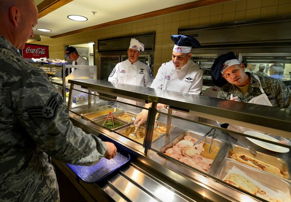 Chief Master Sgt. Tom Mason, the 919th Special Operations Wing command chief, Col.s James Phillips, 919th SOW commander and Kurt Matthews, 919th Special Operations Group commander, serve up the holiday meal at the Duke Field dining facility Dec. 6.  Members of the wing’s leadership took turns serving up the lunch meal to the Airmen during the unit training assembly.  (U.S. Air Force photo/Tech. Sgt. Cheryl Foster)   