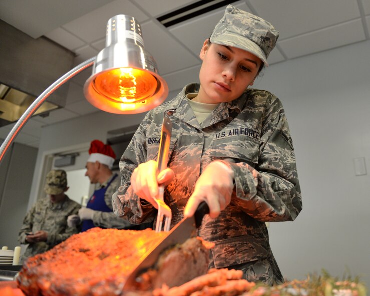 Airman 1st Class Darien Brea prepares the holiday meal, Dec. 6, 2014 at Pease Air National Guard Base, N.H. She is assigned to the 157th Force Support Squadron here. (U.S. Air National Guard photo by Staff Sgt. Curtis J. Lenz)