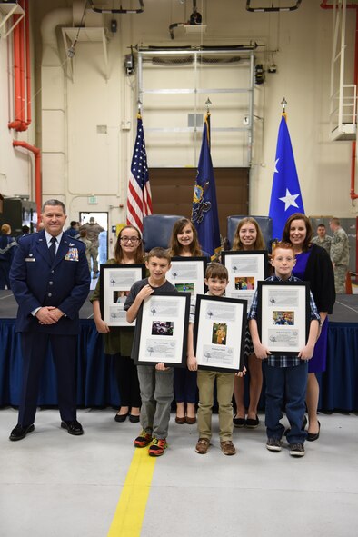 Six children of 193rd Special Operations Wing, Middletown, Pennsylvania, members were presented Child of the Year awards by Col. John Dickinson, 193rd SOW commander, and retired Tech. Sgt. Pamela Nee, Child of the Year Award coordinator, during the wing’s Annual Awards Ceremony Dec. 7, 2014. This award is presented to military children who exemplify the Air Force Core Values and who contribute selflessly to their communities. (U.S. Air National Guard photo by Staff Sgt. Claire Behney/Released)