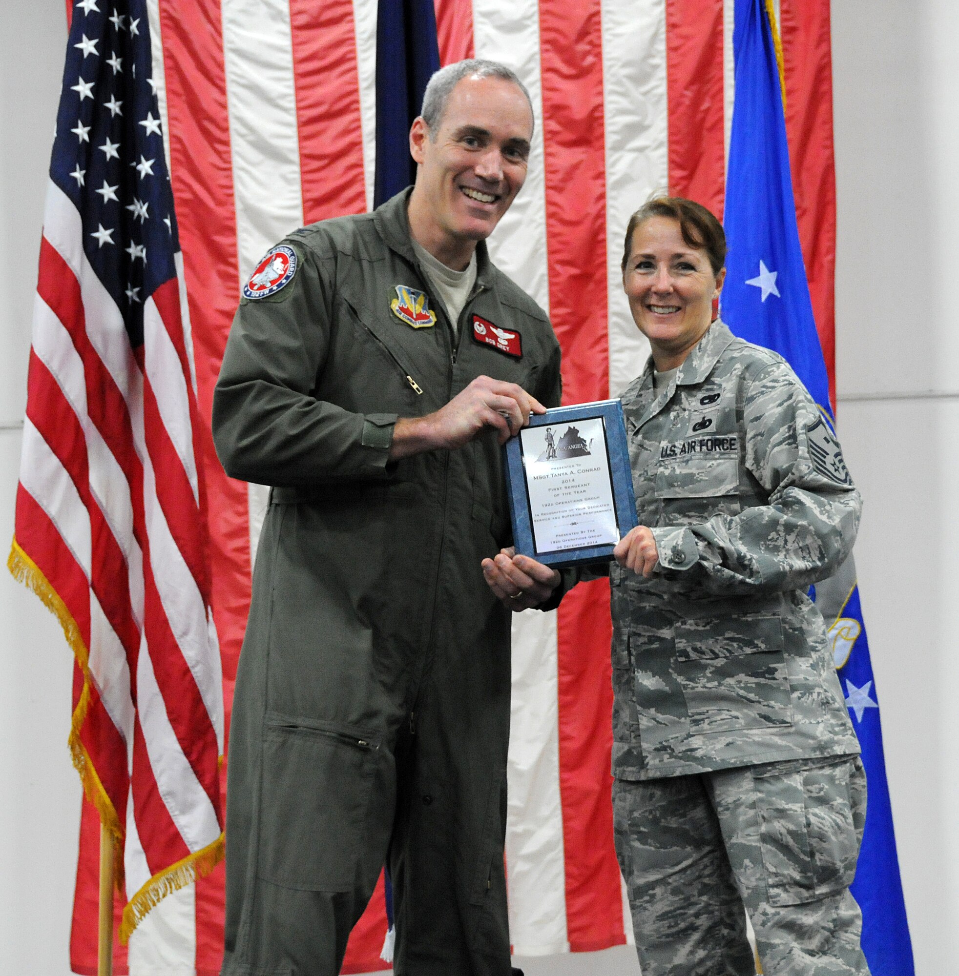 Members from the 192nd Fighter Wing came together to honor and recognize the achievements of the Fighter Wing “Airmen of the Year” during the third annual holiday banquet and awards event, December 6, 2014 at Joint Base Langley-Eustis, Virginia. Airmen from the Fighter Wing Staff, Maintenance, Medical, Mission Support and Operations Groups were recognized for their efforts and achievements during 2014. Each group honored their respective airmen with an award at the event as Senior Airman Zachary D. Bombay, Staff Sgt. Winston B. Obermuller, Master Sgt. Hector Rosado, and First Master Sgt. Tanya A. Conrad competed to earn the “Top Airmen” for the Fighter Wing. (U.S. Air National Guard photo by Airman 1st Class Johnisa B. Roberts/Released)