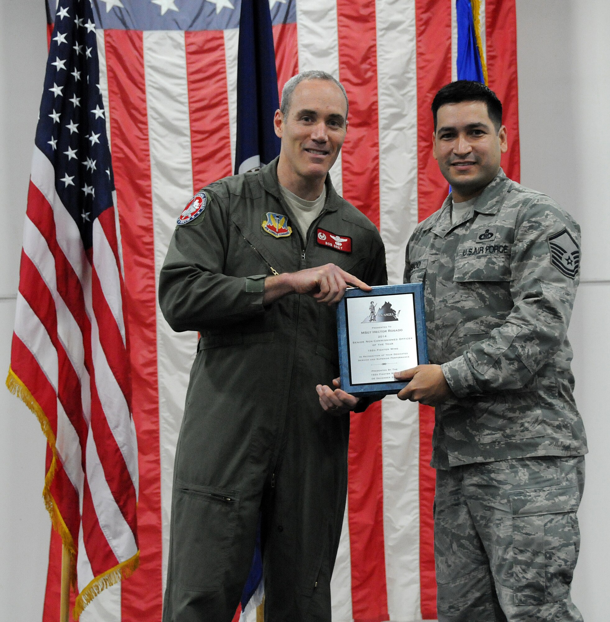 Members from the 192nd Fighter Wing came together to honor and recognize the achievements of the Fighter Wing “Airmen of the Year” during the third annual holiday banquet and awards event, December 6, 2014 at Joint Base Langley-Eustis, Virginia. Airmen from the Fighter Wing Staff, Maintenance, Medical, Mission Support and Operations Groups were recognized for their efforts and achievements during 2014. Each group honored their respective airmen with an award at the event as Senior Airman Zachary D. Bombay, Staff Sgt. Winston B. Obermuller, Master Sgt. Hector Rosado, and First Master Sgt. Tanya A. Conrad competed to earn the “Top Airmen” for the Fighter Wing. (U.S. Air National Guard photo by Airman 1st Class Johnisa B. Roberts/Released)