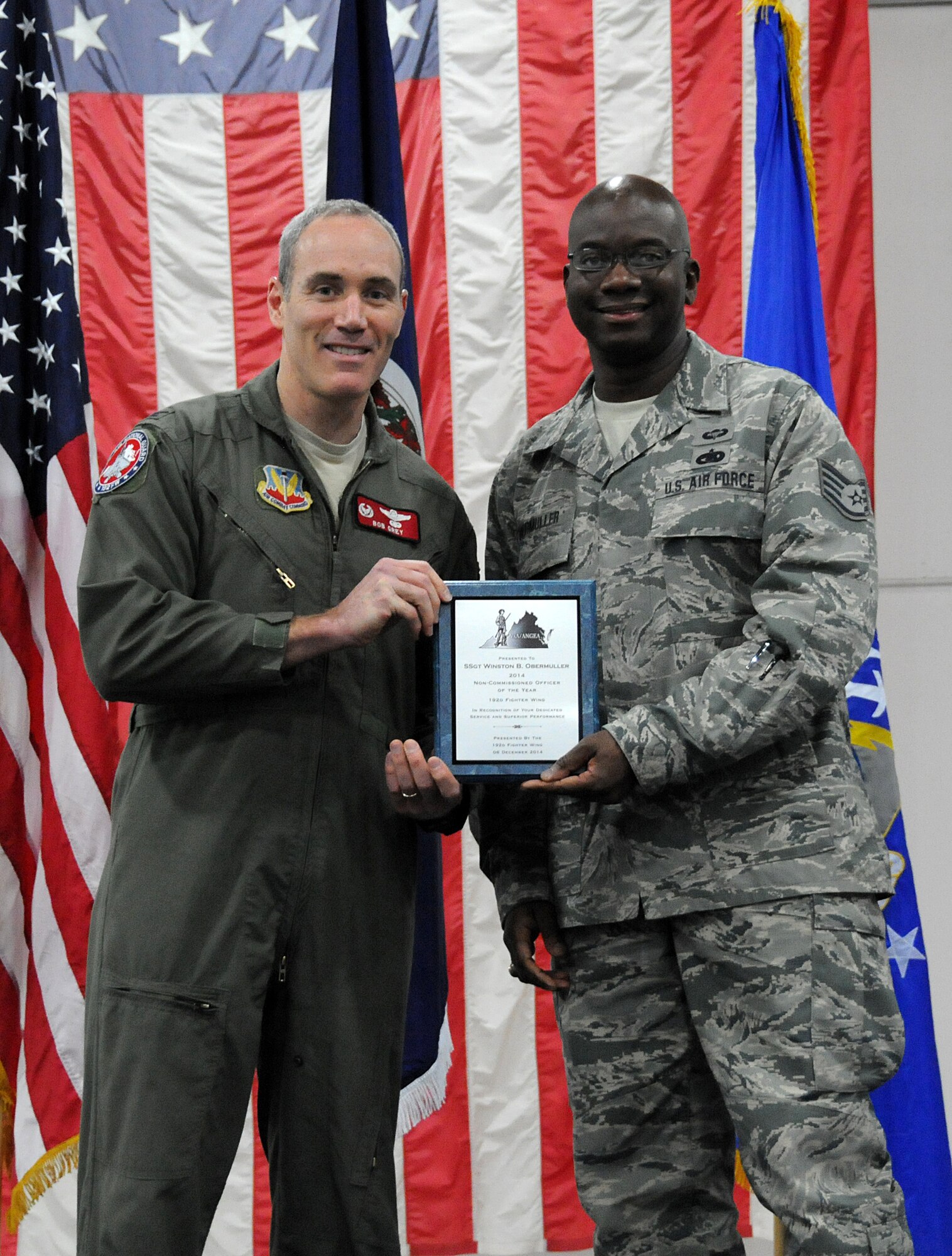 Members from the 192nd Fighter Wing came together to honor and recognize the achievements of the Fighter Wing “Airmen of the Year” during the third annual holiday banquet and awards event, December 6, 2014 at Joint Base Langley-Eustis, Virginia. Airmen from the Fighter Wing Staff, Maintenance, Medical, Mission Support and Operations Groups were recognized for their efforts and achievements during 2014. Each group honored their respective airmen with an award at the event as Senior Airman Zachary D. Bombay, Staff Sgt. Winston B. Obermuller, Master Sgt. Hector Rosado, and First Master Sgt. Tanya A. Conrad competed to earn the “Top Airmen” for the Fighter Wing. (U.S. Air National Guard photo by Airman 1st Class Johnisa B. Roberts/Released)