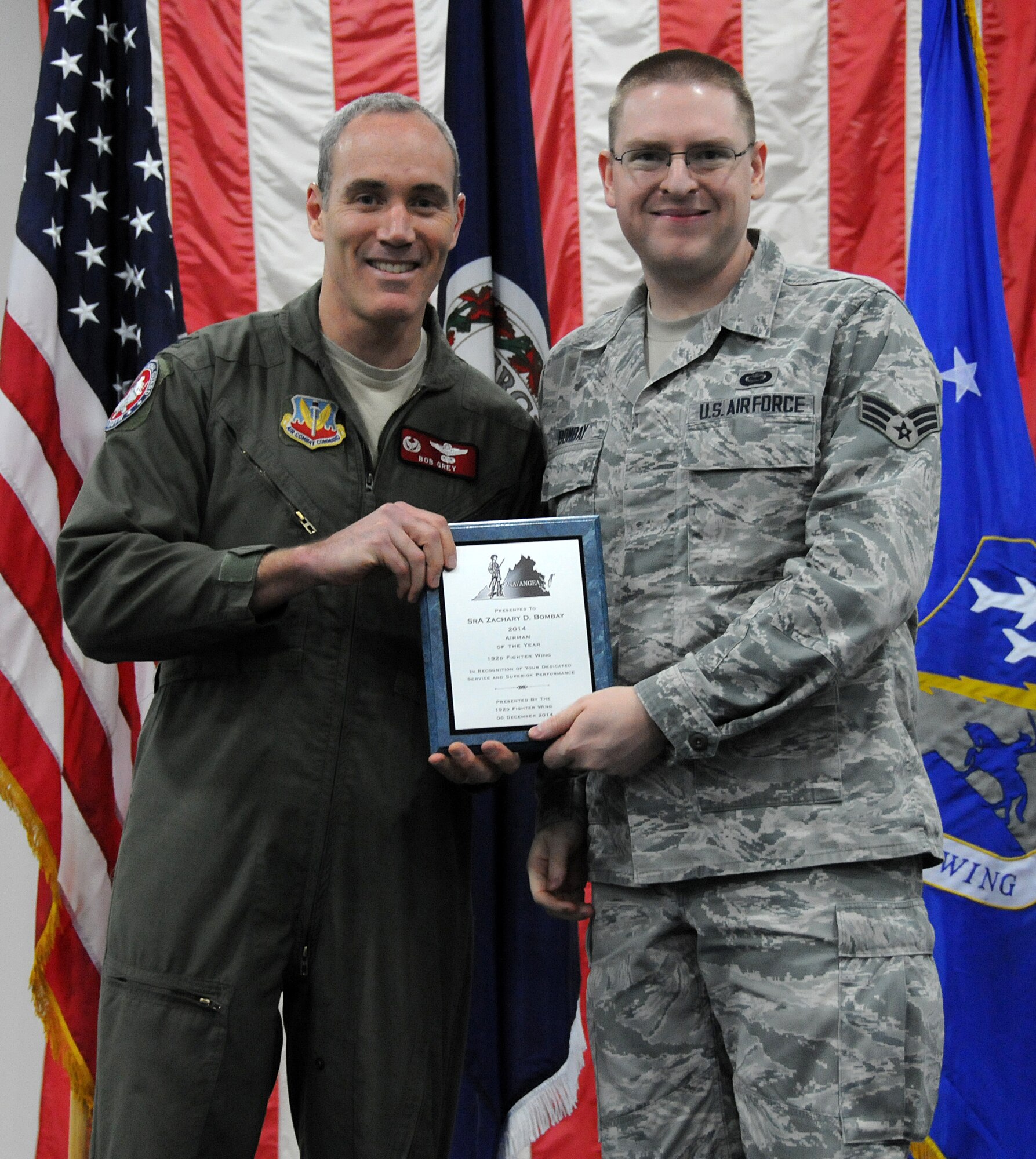 Members from the 192nd Fighter Wing came together to honor and recognize the achievements of the Fighter Wing “Airmen of the Year” during the third annual holiday banquet and awards event, December 6, 2014 at Joint Base Langley-Eustis, Virginia. Airmen from the Fighter Wing Staff, Maintenance, Medical, Mission Support and Operations Groups were recognized for their efforts and achievements during 2014. Each group honored their respective airmen with an award at the event as Senior Airman Zachary D. Bombay, Staff Sgt. Winston B. Obermuller, Master Sgt. Hector Rosado, and First Master Sgt. Tanya A. Conrad competed to earn the “Top Airmen” for the Fighter Wing. (U.S. Air National Guard photo by Airman 1st Class Johnisa B. Roberts/Released)