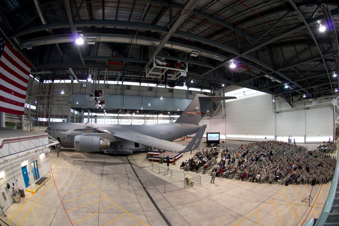 The 167th Airlift Wing in Martinsburg, W.Va. held a ceremony to commemorate the wing's transition to the C-17 Globemaster III, Dec. 6, 2014. The ceremony included a wing history video, tribute to flight engineers, a presentation from Boeing, and remarks from several distinguished visitors. The wing also celebrated family with various family activities. (Air National Guard Photo by Staff Sgt. Jodie Witmer/Released)