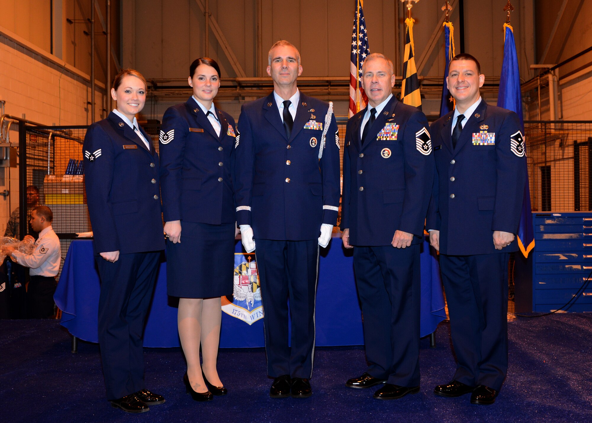 The winners of the 2015 Airmen of the Year contest for the 175th Wing Maryland Air National Guard pose for a group picture following the ceremony at Warfield Air National Guard Base, Baltimore, MD, December 7, 2014. The winners are (from L – R) Senior Airman Jennifer Masters, 175th Operations Support Squadron, Tech. Sgt. Juliann Johnston, 175th Logistics Readiness Squadron, Master Sgt. Michael Glaze, 175th Civil Engineering Squadron, Senior Master Sgt. Steven Mooney, 175th Logistics Readiness Squadron and Master Sgt. Robert Ignozzi, 175th Maintenance Squadron. (U.S. Air National Guard Photo by Tech. Sgt. Christopher Schepers/RELEASED)
