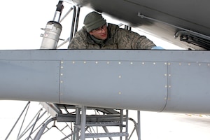 141206-Z-VA676-017 -- Airman 1st Class Mike Fontana, 191st Maintenance Squadron, performs a visual inspection on part of the boom on a KC-135 Stratotanker at Selfridge Air National Guard Base, Mich., Dec. 6, 2014. Fontana has been working as a crew chief at Selfridge for about a year. (U.S. Air National Guard photo by Tech. Sgt. Dan Heaton)