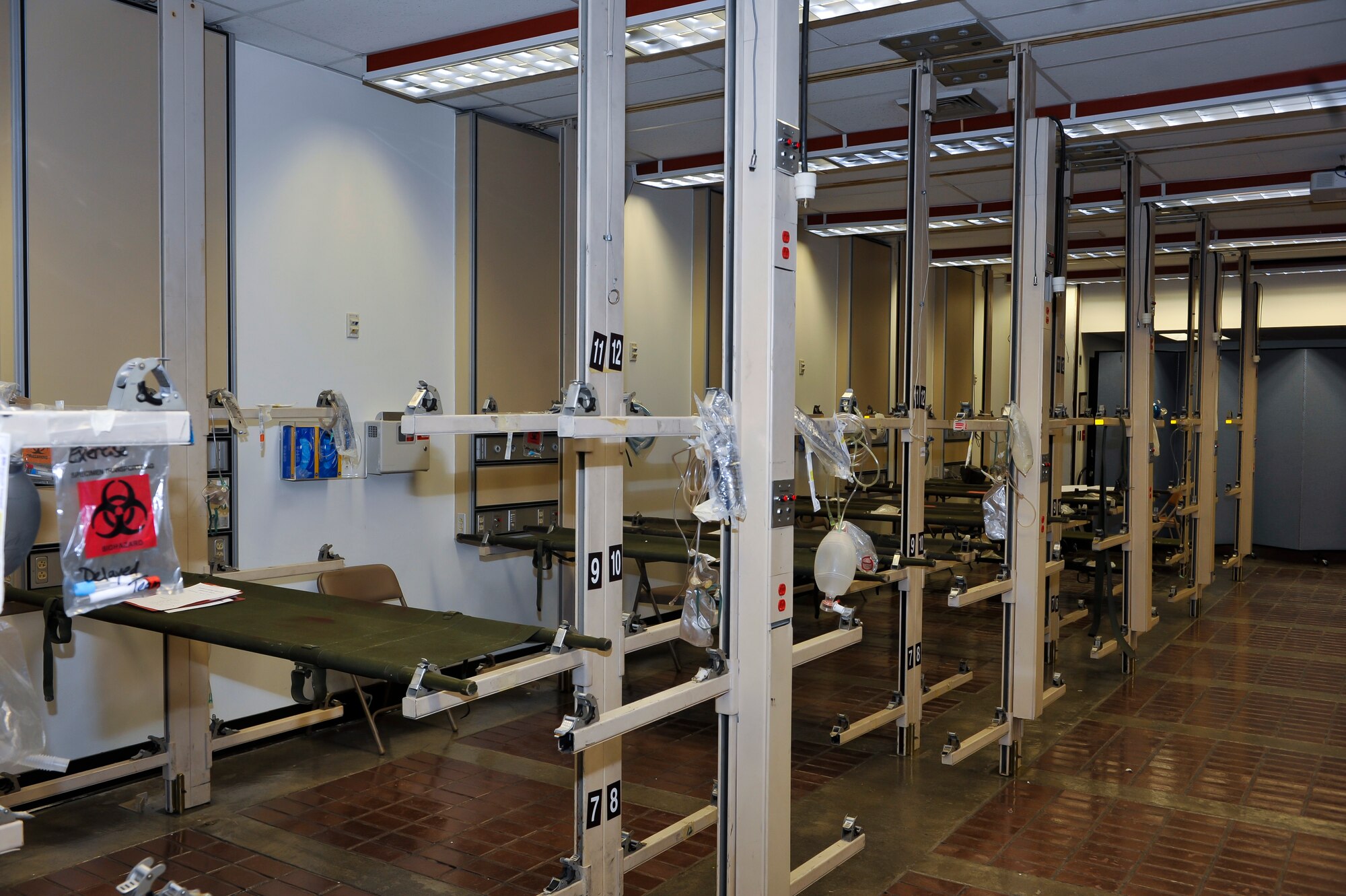 Cots are set up at the Medical Group to receive casualties who have minimal injuries and do not have immediate threats to life, limbs or eye site Dec. 6, 2014, at Osan Air Base, Republic of Korea. A surgical disaster team is a component of the hospital set up to take care of patients who may have a variety of injuries. (U.S. Air Force photo by Senior Airman David Owsianka)