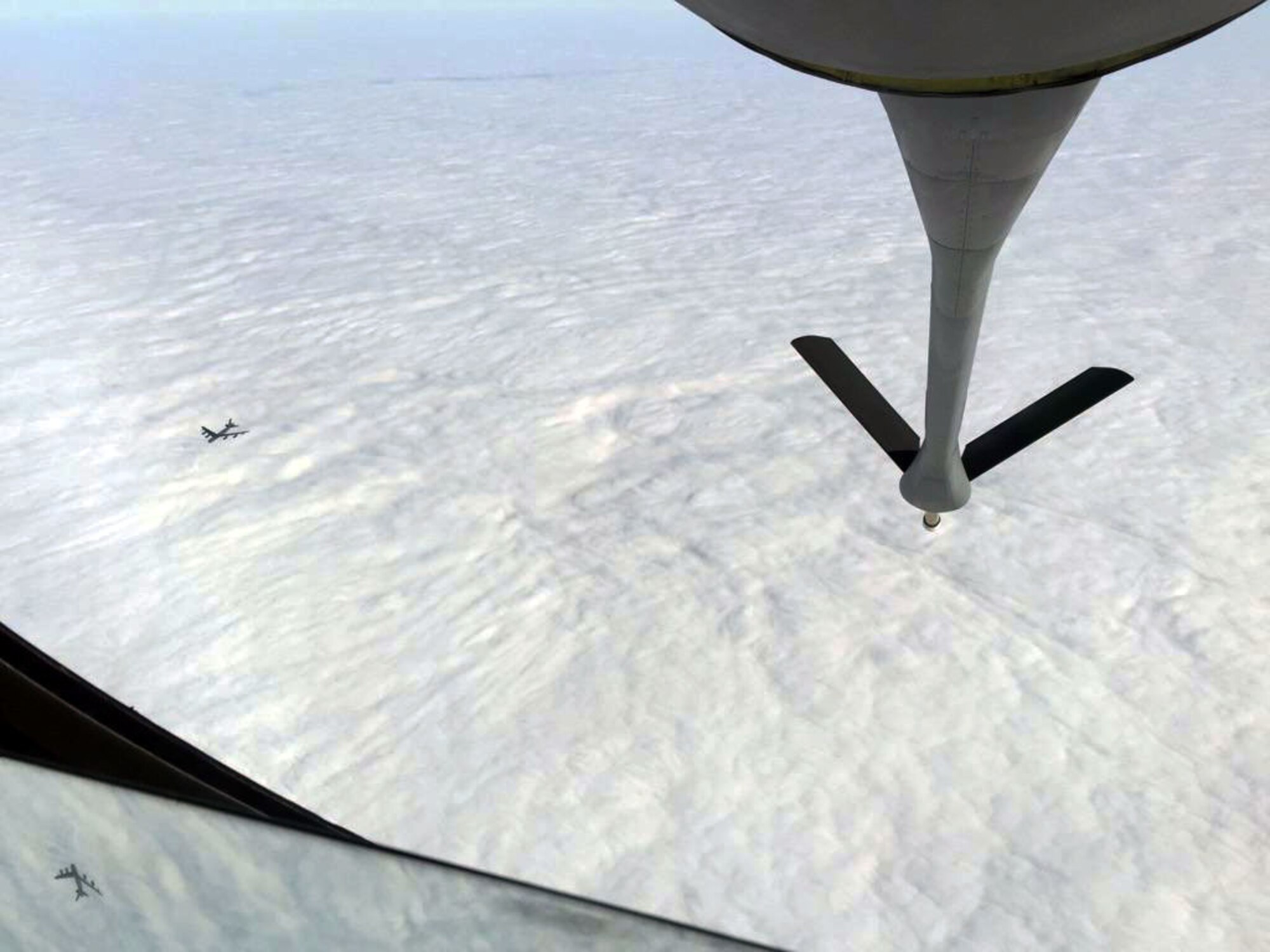 A B-52 Stratofortress assigned to Barksdale Air Force Base, La., trails behind a KC-135 Stratotanker from McConnell Air Force Base, Kan., during an air refueling training exercise, Dec. 6, 2014. The KC-135 was operated by an aircrew from the Air Force Reserve 931st Air Refueling Group at McConnell. (U.S. Air Force photo by Senior Master Sgt. Ray Lewis)