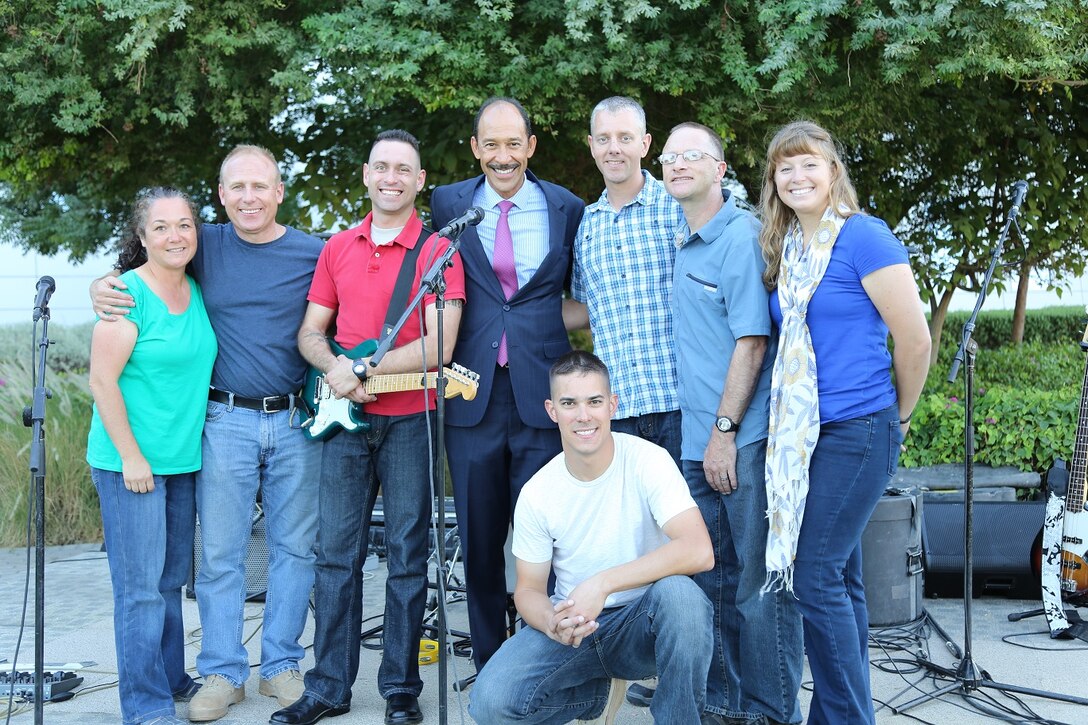 The U.S. Ambassador to the United Arab Emirates, Michael Corbin (center), stands with members of the U.S. Air Forces Central Command Band, "Touch 'N Go," after a special Veterans Day performance on Nov 10, 2014. The band was requested to provide American popular music for the event which catered to embassy personnel and their families.  (Courtesy photo)
