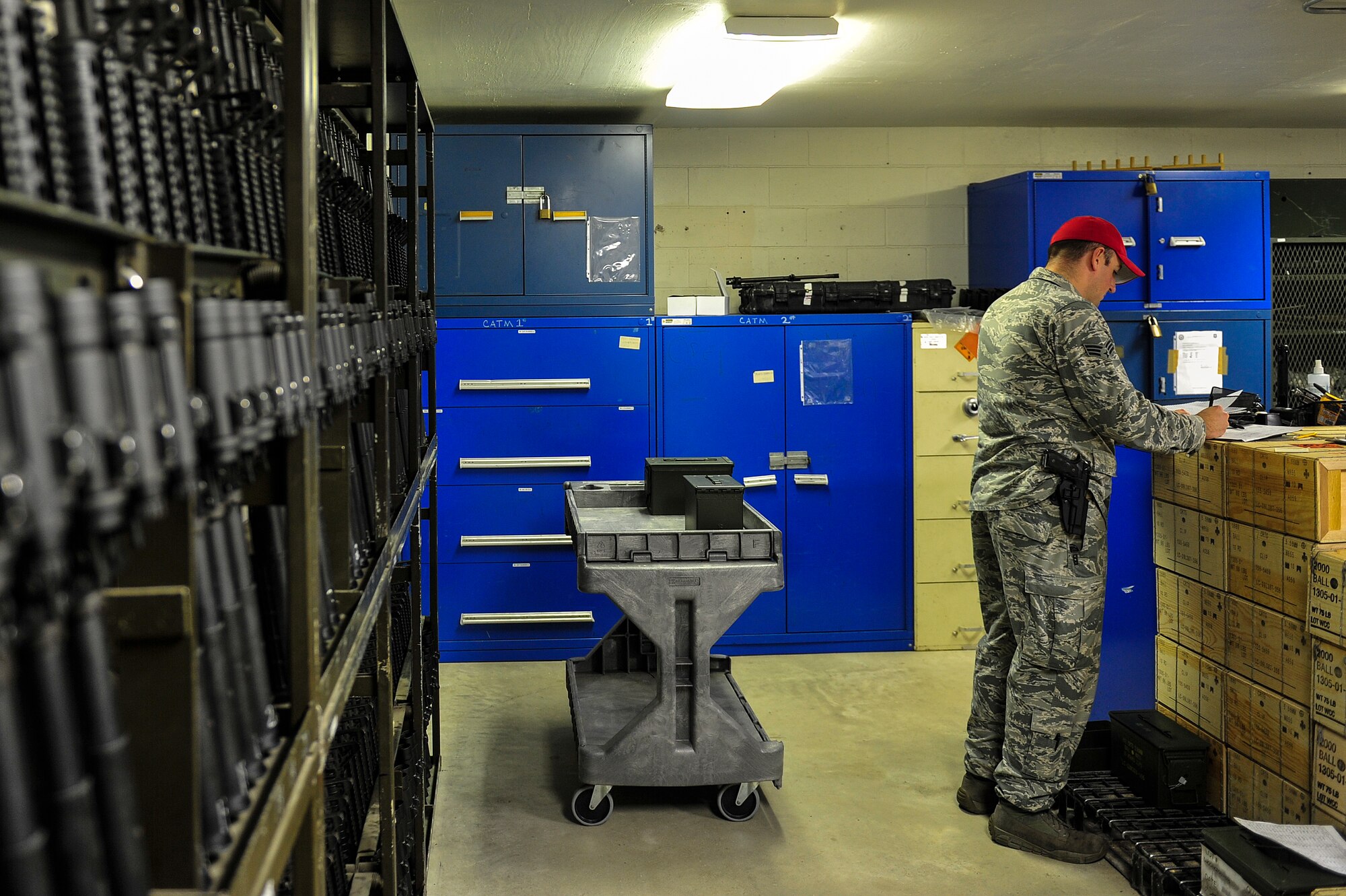 Senior Airman Christopher Crawley, 1st Special Operations Security Forces Squadron Combat Arms Training and Maintenance instructor, returns ammo to the CATM armory at Hurlburt Field, Fla., December 2, 2014. CATM instructors provide firing training and maintain all weapons used by CATM and Security Forces. (U.S. Air Force photo/Airman 1st Class Jeff Parkinson)