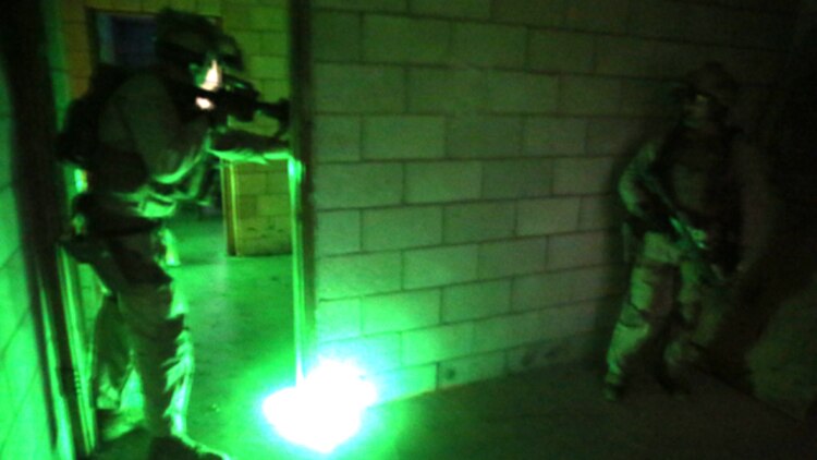 U.S. Marines with the 15th Marine Expeditionary Unit’s Maritime Raid Force conduct a raid during realistic urban training aboard Camp San Luis Obispo, Calif., Dec. 5, 2014. RUT prepares the Marines of the 15th MEU for their upcoming deployment, enhancing their combat skills in environments similar to those they may find in future missions. (U.S. Marine Corps photo by Cpl. Anna Albrecht/Released)