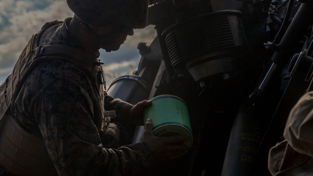 Lance Cpl. Jacob T. Madar prepares to insert a powder casing into the breach of an M777A2 lightweight 155 mm howitzer Nov. 7 at the during Artillery Relocation Training Program 14-3. ARTP is a regularly scheduled training event that strengthens combat readiness of U.S. Marine forces, and supports the U.S.-Japan Treaty of Mutual Cooperation and Security. Madar is from Saint Clair Shores, Michigan, and is a field artillery cannoneer with Battery I, 3rd Battalion, 11th Marine Regiment, 1st Marine Division, based out of Twentynine Palms, California, and is currently assigned to 3rd Battalion, 12th Marine Regiment, 3rd Marine Division, III Marine Expeditionary Force, under the unit deployment program.