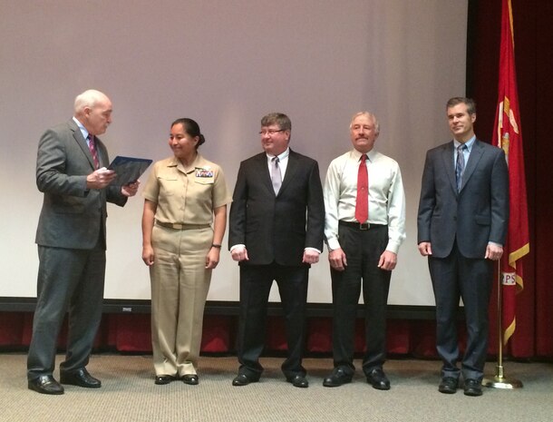 Facilities employees at Marine Corps Base Quantico were recognized by Assistant Secretary of the Navy Dennis McGinn for their efforts in reducing energy usage by 27 percent, since 2003.