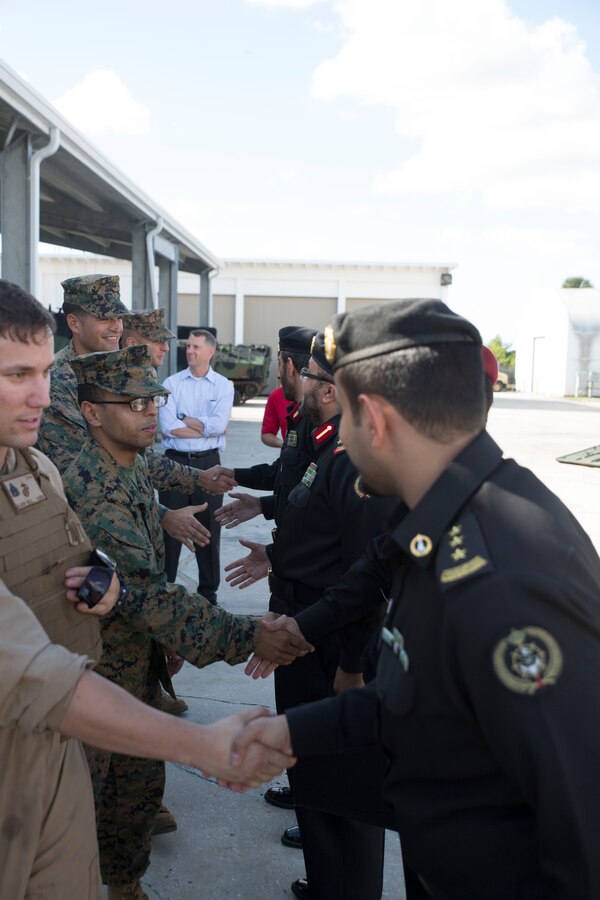 Marines with 4th Assault Amphibian Battalion are formally introduced to and shake hands with the Saudi Arabian Marine officers at Marine Corps Reserve Training Center in Tampa, Fla., Dec. 5, 2014. Saudi Arabian Marine officers visited Marines with 4th AA Bn. to attend a demonstration about the capabilities of assault amphibious vehicles. (U.S. Marine Corps photo by Lance Cpl. Ian Ferro)