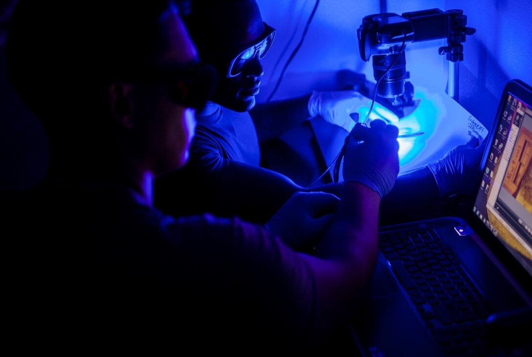 U.S. Marines with the Law Enforcement Detachment, 15th Marine Expeditionary Unit, test a cellphone for fingerprints during realistic urban training aboard Fort Hunter Liggett, Calif., Dec. 6, 2014. RUT prepares the 15th MEU Marines for their upcoming deployment, enhancing their combat skills in environments similar to those they may find in future missions. (U.S. Marine Corps photo by Cpl. Elize McKelvey/Released)