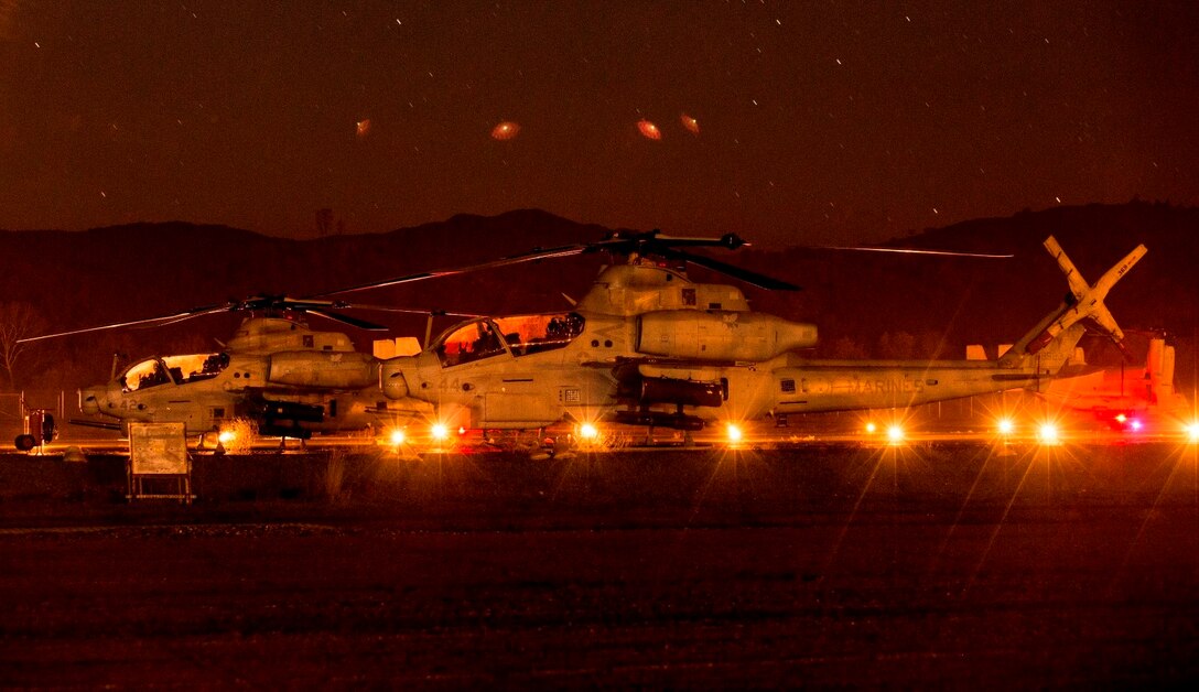 AH-1Z Vipers with Marine Medium Tiltrotor Squadron 161 (Reinforced), 15th Marine Expeditionary Unit, prepare for a tactical recovery of aircraft and personnel mission during realistic urban training aboard Fort Hunter Liggett, Calif., Dec. 7, 2014.  RUT prepares the 15th MEU's Marines for their upcoming deployment, enhancing their combat skills in environments similar to those they may find in future missions. (U.S. Marine Corps HDR photo by Sgt. Jamean Berry/Released)