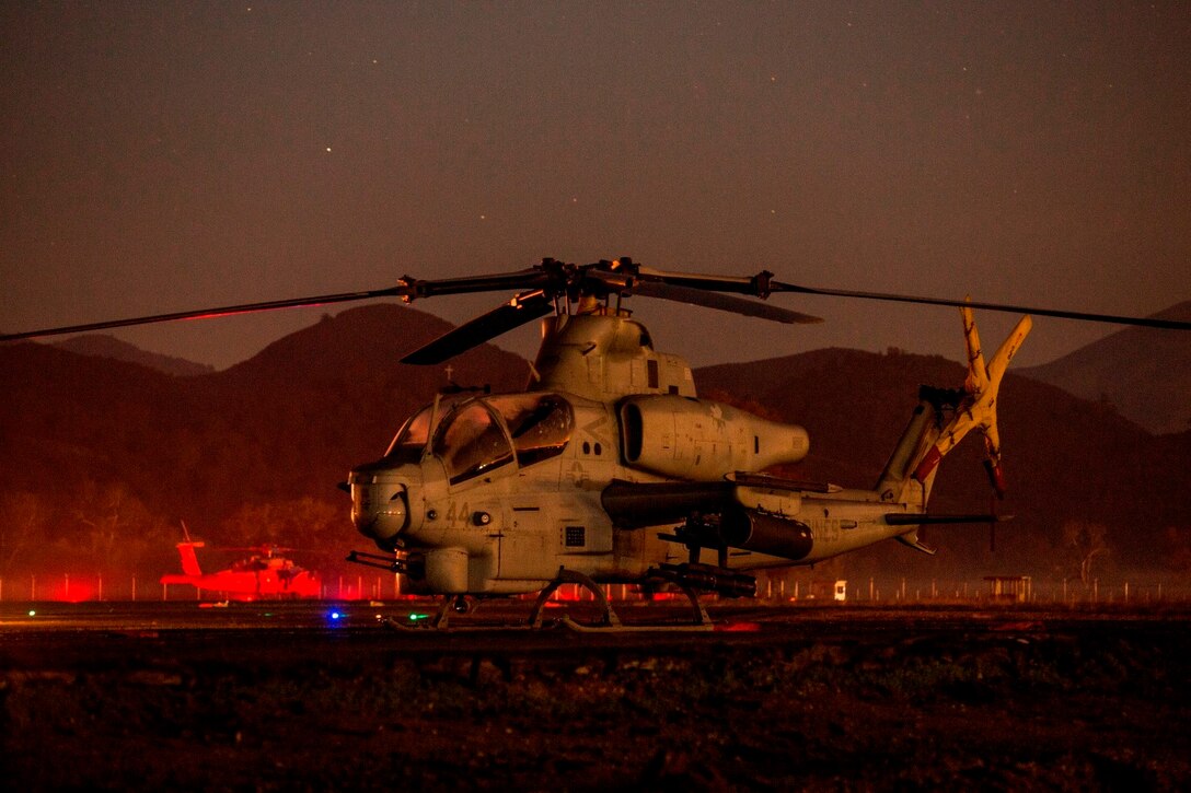An AH-1Z Viper with Marine Medium Tiltrotor Squadron 161 (Reinforced), 15th Marine Expeditionary Unit, prepares for a tactical recovery of aircraft and personnel mission during realistic urban training aboard Fort Hunter Liggett, Calif., Dec. 7, 2014.  RUT prepares the 15th MEU's Marines for their upcoming deployment, enhancing their combat skills in environments similar to those they may find in future missions. (U.S. Marine Corps photo by Sgt. Jamean Berry/Released)