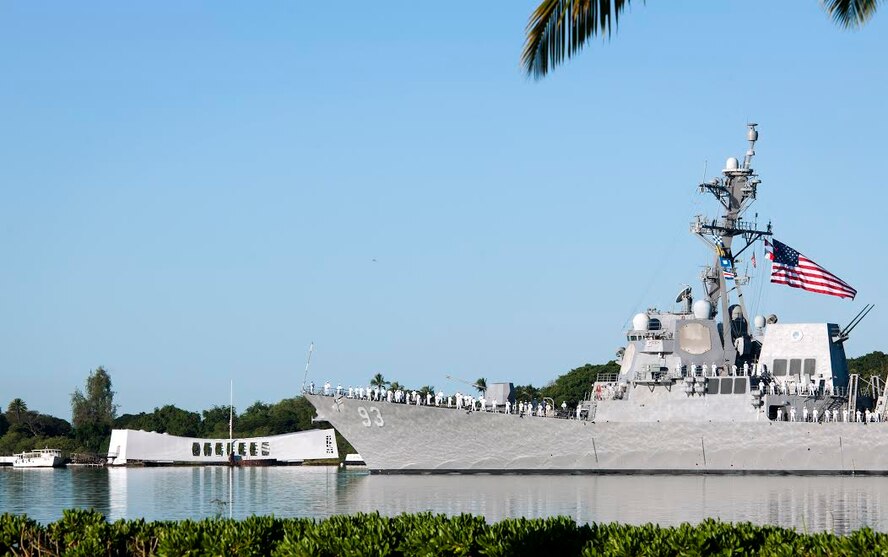 The guided-missile destroyer USS Chung-Hoon (DDG 93) conducts a pass-in-review by the USS Arizona Memorial during the 73rd Anniversary Pearl Harbor Day commemoration ceremony at the Pearl Harbor Visitor Center, Hawaii, Dec. 7, 2014. More than 2,000 guests, including Pearl Harbor survivors and other veterans, attended the National Park Service and U.S. Navy-hosted joint memorial ceremony at the World War II Valor in the Pacific National Monument. This year's theme focused on "Preserving the Memory." (U.S. Navy photo by Mass Communication Specialist 2nd Class Diana Quinlan/Released)