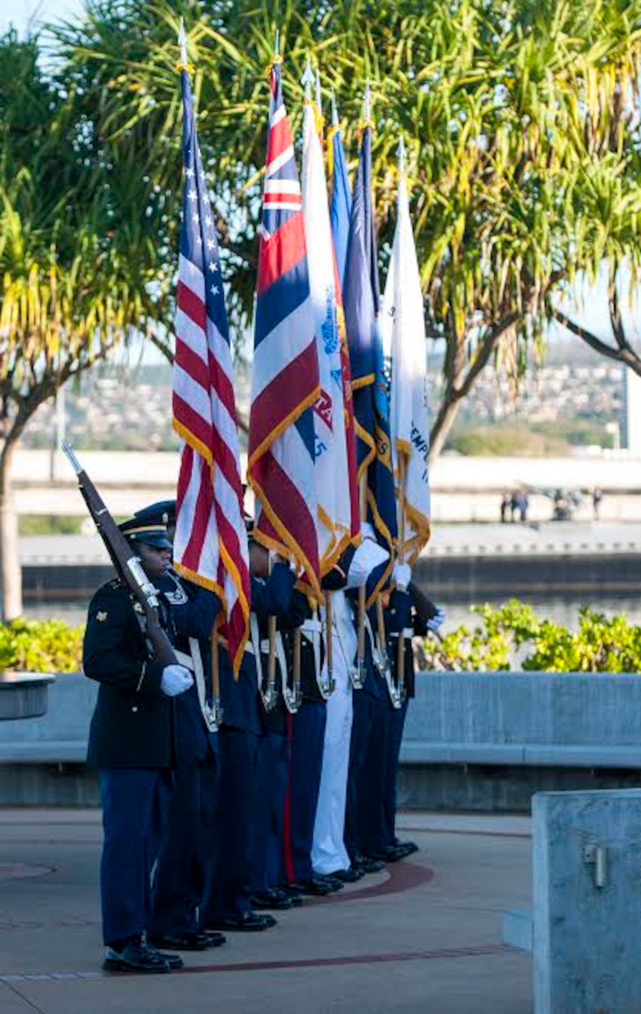 A joint service color guard parades the colors during the 73rd Anniversary Pearl Harbor Day commemoration ceremony at the Pearl Harbor Visitor Center, Hawaii, Dec. 7, 2014. More than 2,000 guests, including Pearl Harbor survivors and other veterans, attended the National Park Service and U.S. Navy-hosted joint memorial ceremony at the World War II Valor in the Pacific National Monument. This year's theme focused on "Preserving the Memory." (U.S. Navy photo by Mass Communication Specialist 2nd Class Diana Quinlan/Released)