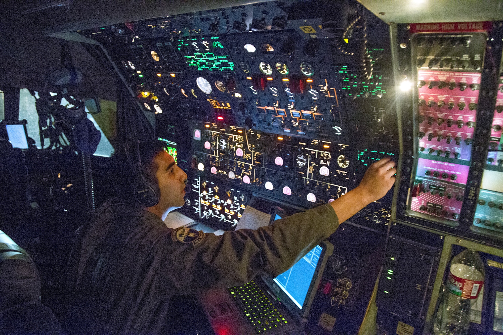 TRAVIS AIR FORCE BASE, Calif. --Staff Sgt. Daniel Massingill, C-5B Galaxy flight engineer with the 312th Airlift Squadron, preflights the aircraft for takeoff from Kadena Air Base, Japan, Aug. 15, 2014. Flight engineers control key systems on the aircraft, including fuel management, electronics and environmental systems. He was flying a mobility channel mission, moving high-priority cargo and passengers among air bases in the U.S. Pacific Command area of responsibility.  (U.S. Air Force photo/Lt. Col. Robert Couse-Baker)