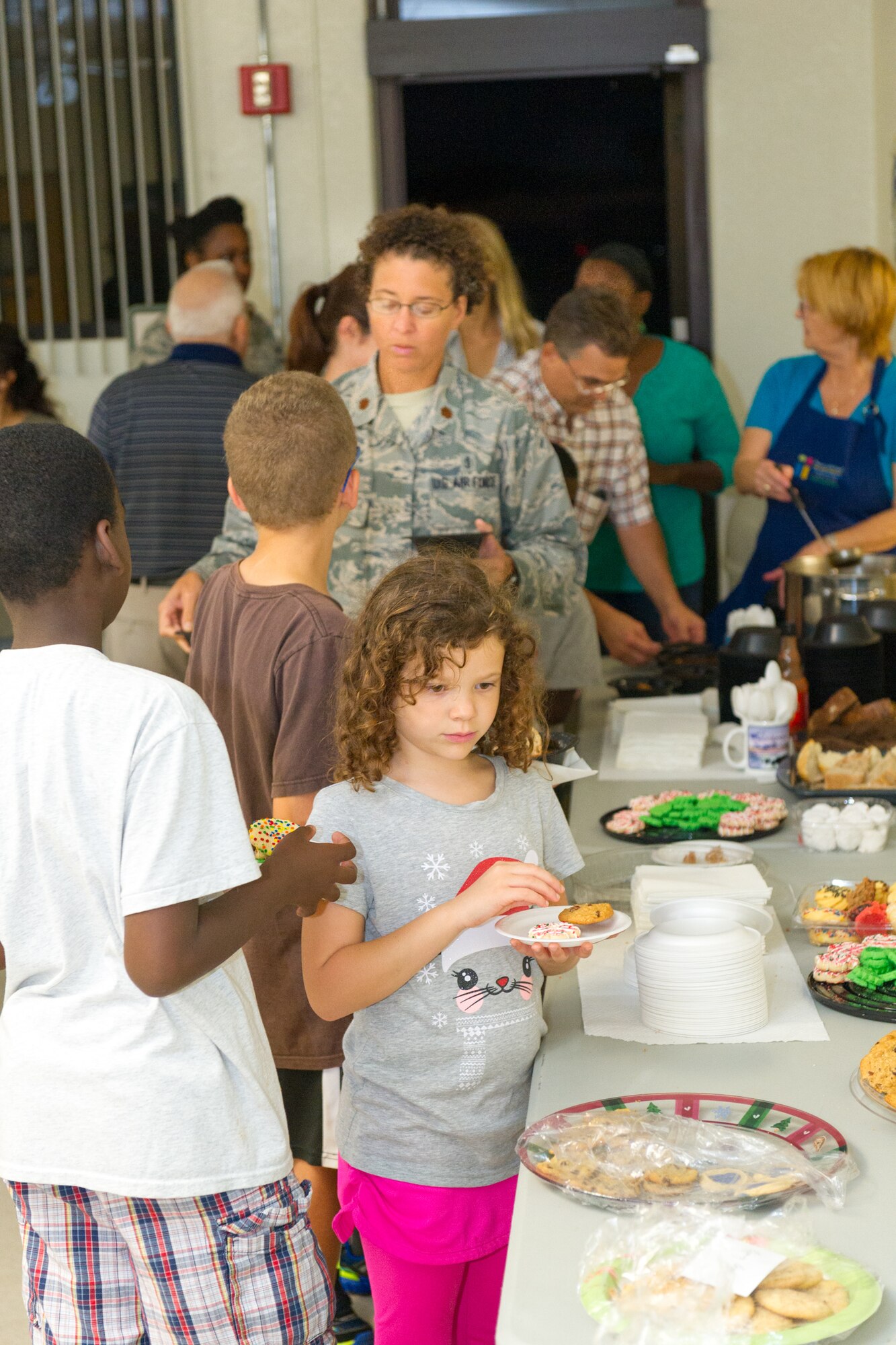 Members of Team Patrick-Cape attended a tree lighting ceremony at the Patrick Air Force Base Seaside Chapel, Dec. 3, 2014, in Fla. In addition to the lighting ceremony, attendees sang carols, ate refreshments, and socialized. (U.S. Air Force photo/Cory Long)