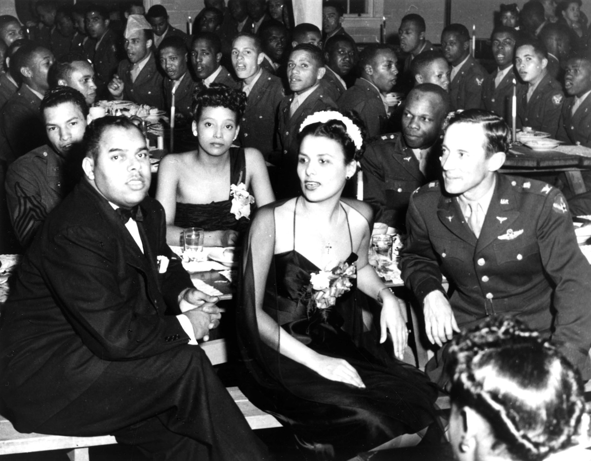 Tuskegee Airmen became heroes to the black community. Here, singer Lena Horne (center), one of their best known supporters, visits Tuskegee aviation cadets. Col. Parrish is on her left. (U.S. Air Force photo)