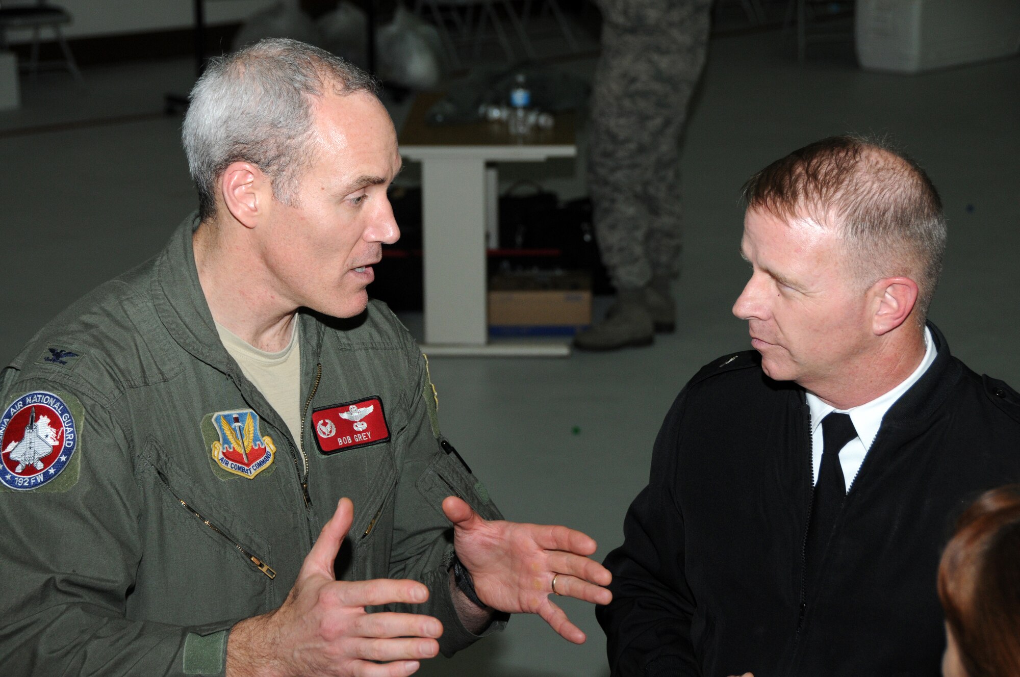 Brig. Gen. Timothy P. Williams, the Adjutant General of Virginia, meets with Col. Robert J. Grey, 192D Fighter Wing commander during the Wing’s third annual holiday celebration and awards event on December 6, 2014, at Langley Air Force Base. Williams congratulated award recipients, thanked members for their service and wished them a safe and happy holiday season.  (U.S. Air National Guard photo by Master Sgt. Carlos J. Claudio/Released)