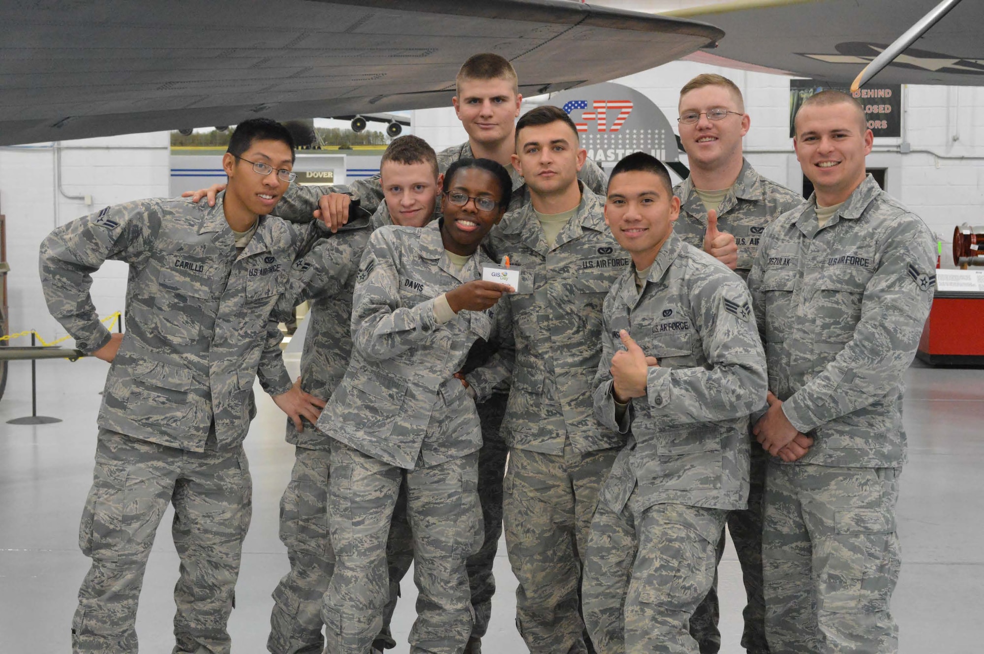 A group of 436th Civil Engineer Squadron engineering assistants pose for a group photo during Geographic Information System (GIS) Day Nov. 19, 2014, at the Air Mobility Command Museum on Dover Air Force Base, Del. GIS Day is a day where kids from a local elementary schools come to the Air Mobility Command Museum and are taught about geographic information systems, cartography and surveying and how they are used at local, state and federal levels. (Courtesy Photo)