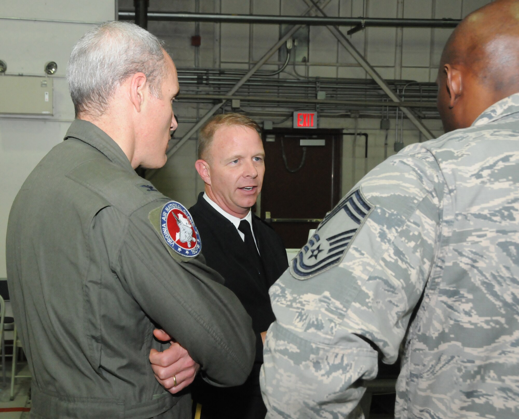 Brig. Gen. Timothy P. Williams, the Adjutant General of Virginia, meets with Airmen from the 192D Fighter Wing during the Wing’s third annual holiday celebration and awards event on December 6, 2014, at Langley Air Force Base. Williams congratulated award recipients, thanked members for their service and wished them a safe and happy holiday season.  (U.S. Air National Guard photo by Master Sgt. Carlos J. Claudio/Released)